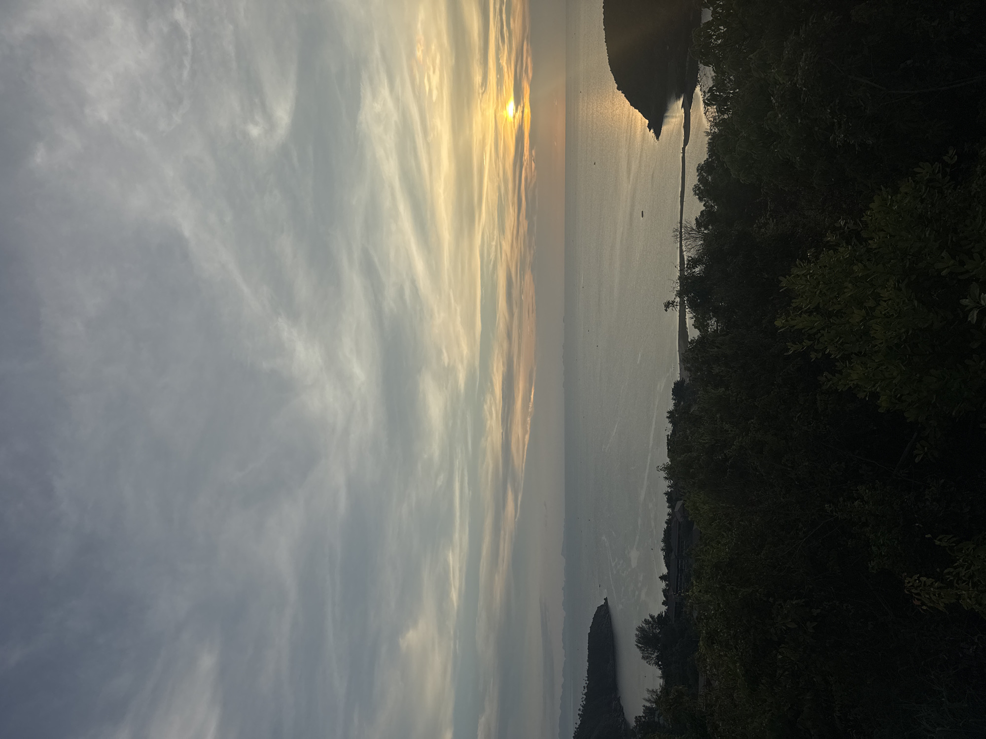 Sunset captured over coastal waters in Baan Wang Ta Kien