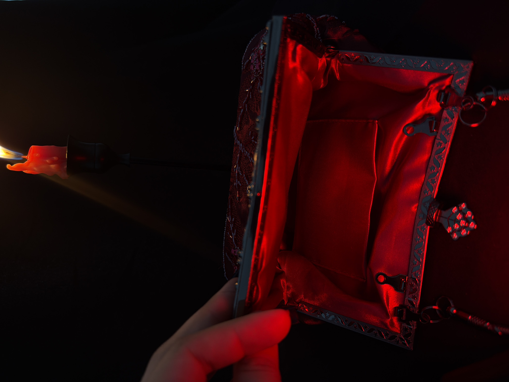 Red candles, incense, and dark aesthetic objects in moody close-ups