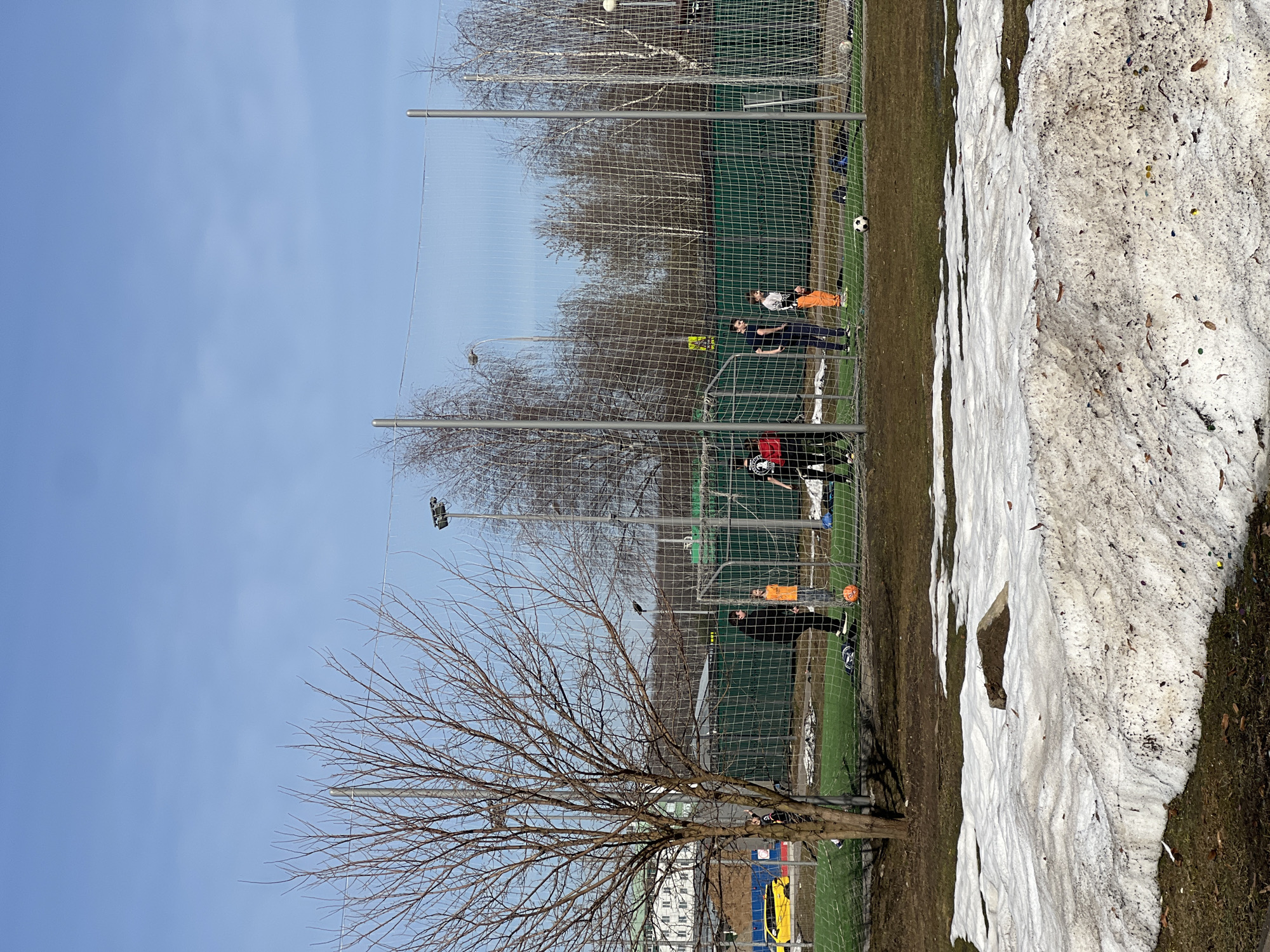 Spring scenes in Moscow: soccer, snowmelt, travel gear
