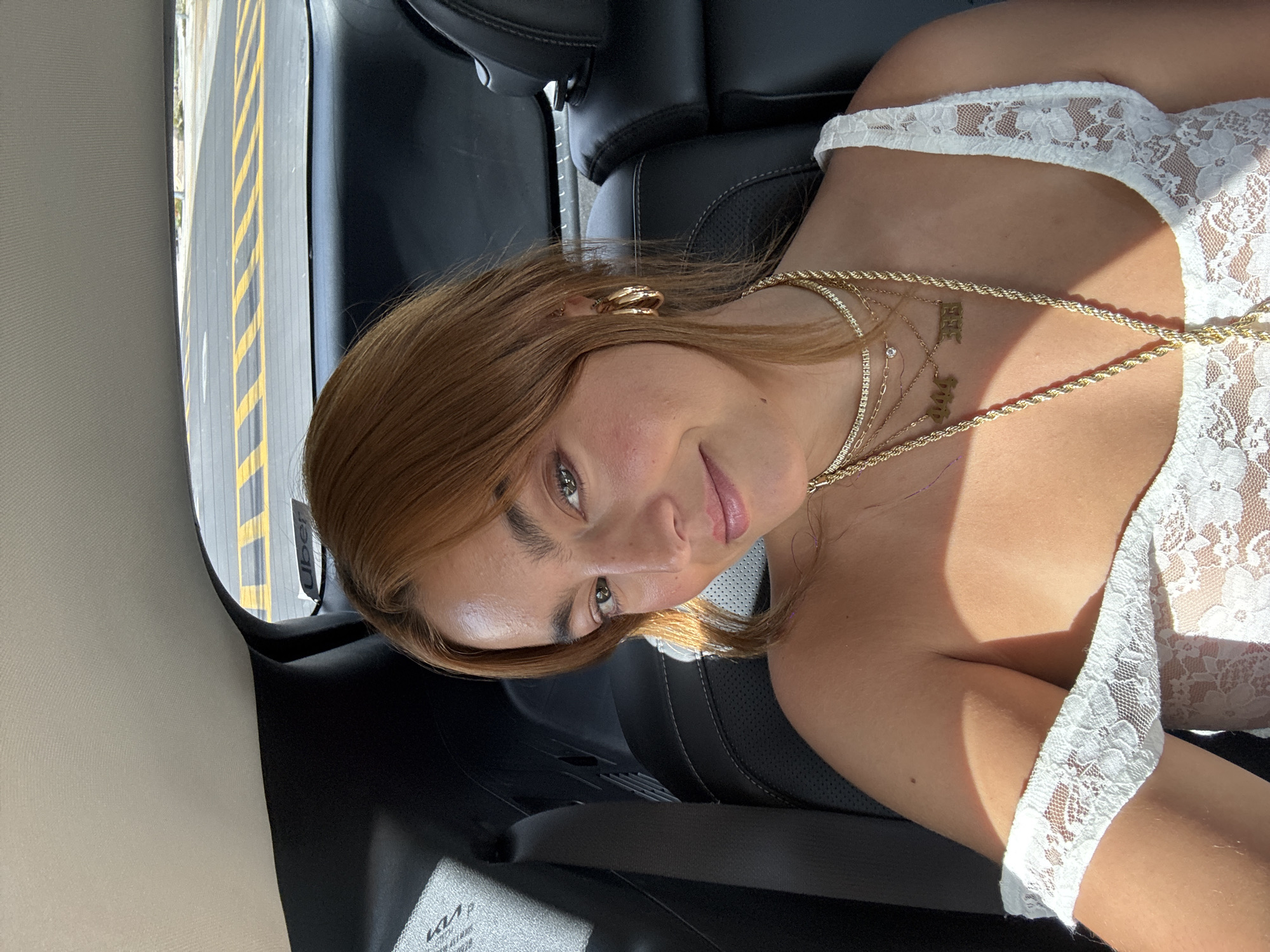 Woman in white lace observed in vehicle backseat, La Quinta