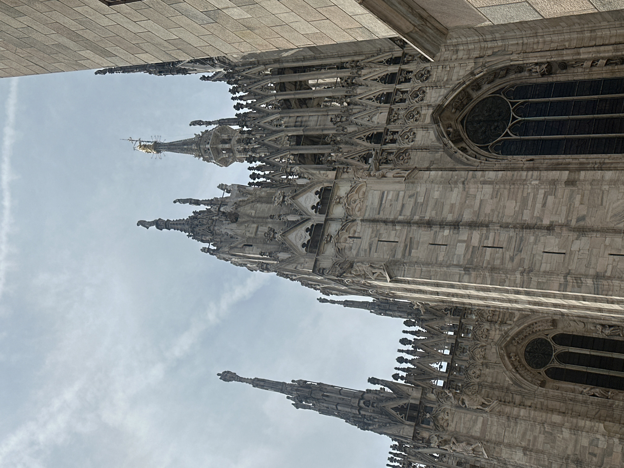 Morning walk through central Milan captures cathedral, shops, street life