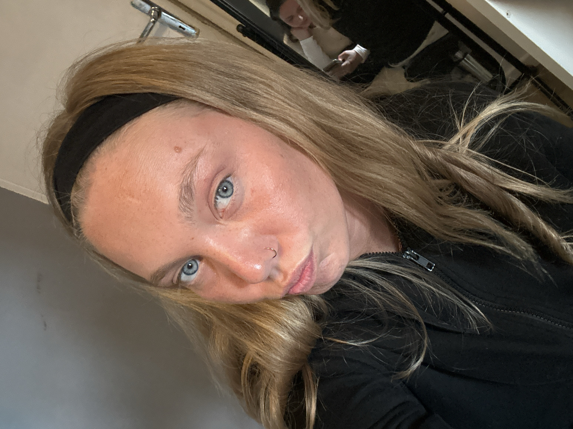 Woman takes selfies indoors in Lannoy, France
