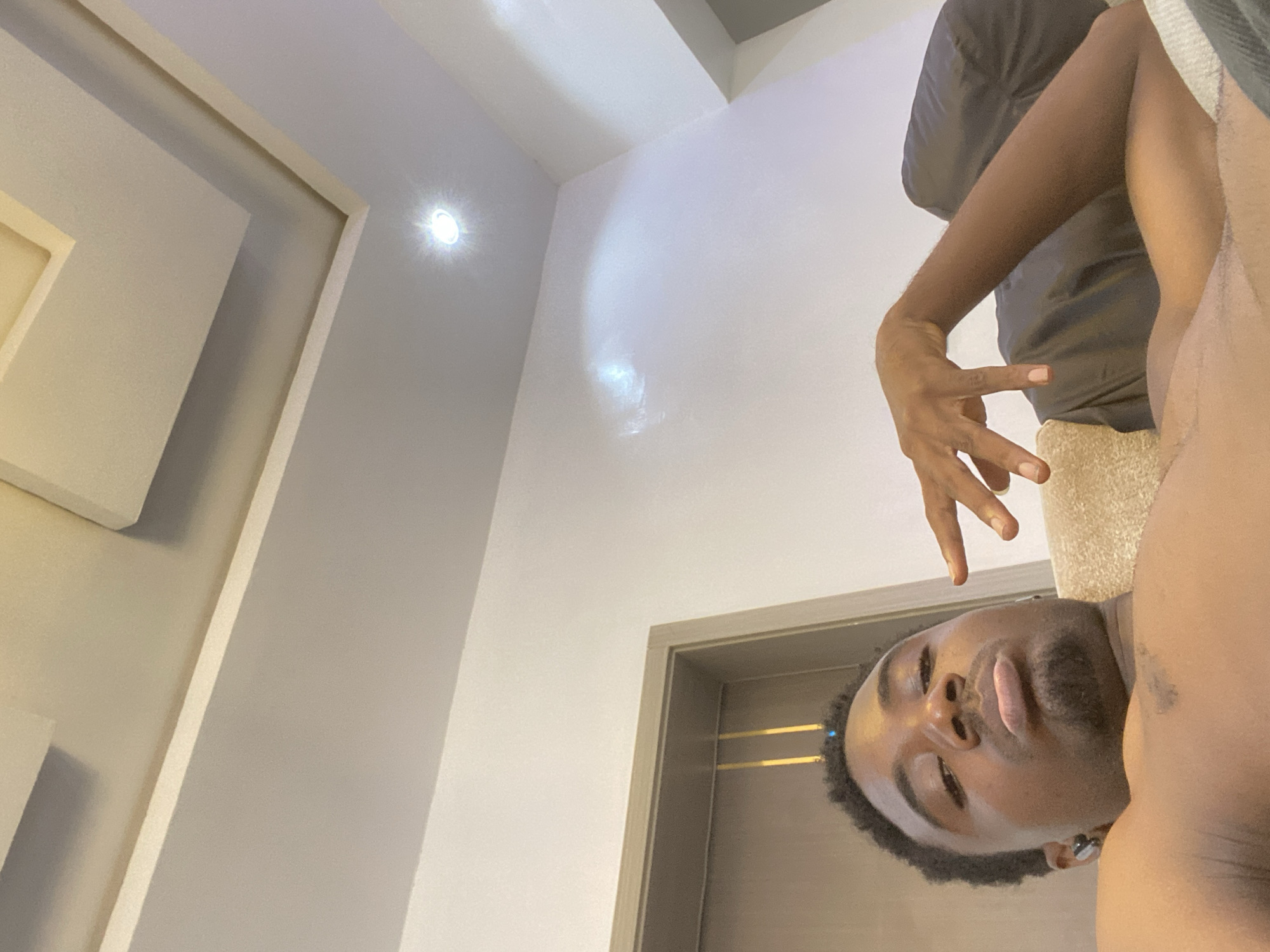 Young man documents morning routine at Ibadan home