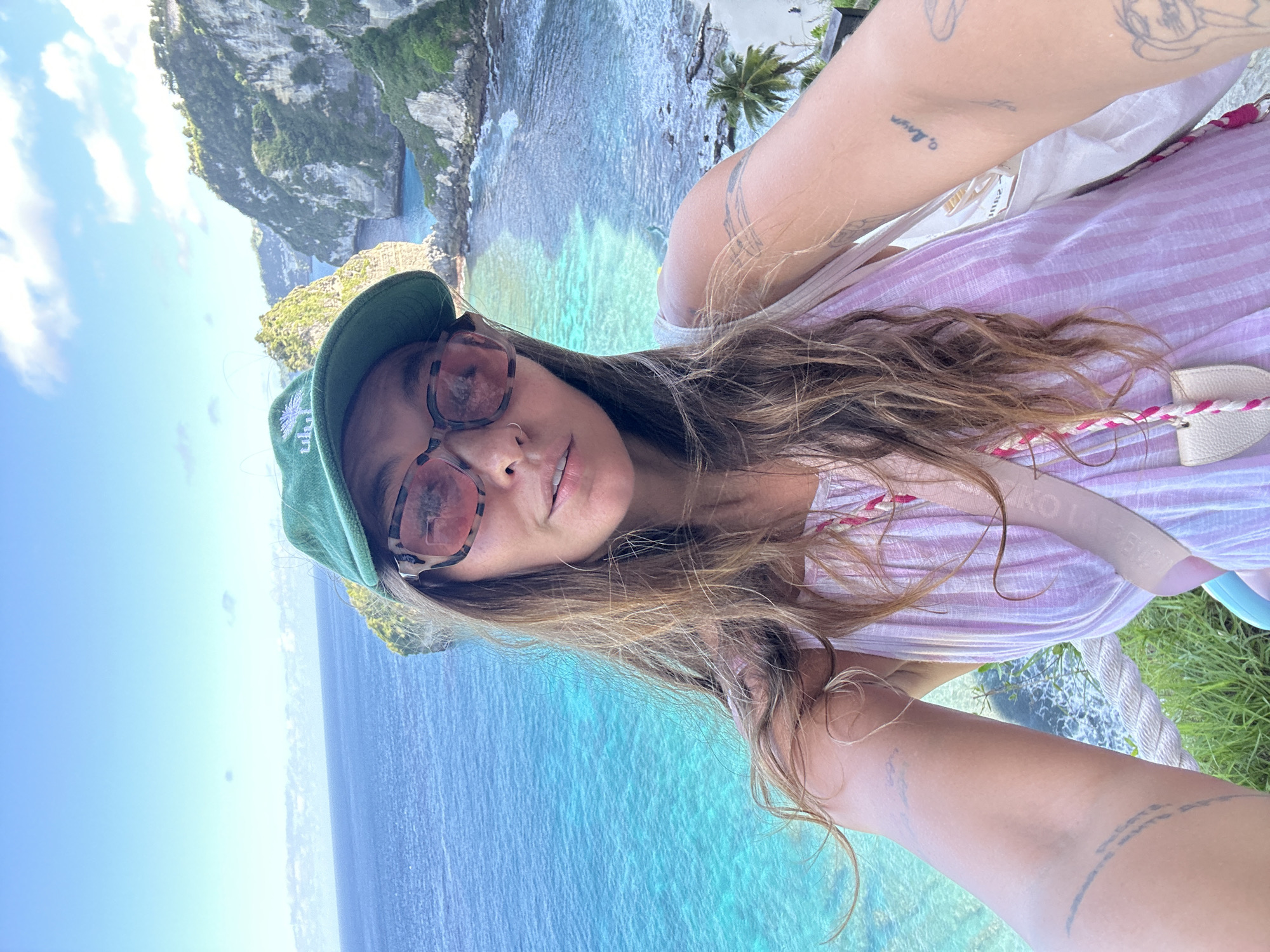 Tourist documents morning visit to Nusa Penida's scenic coastline