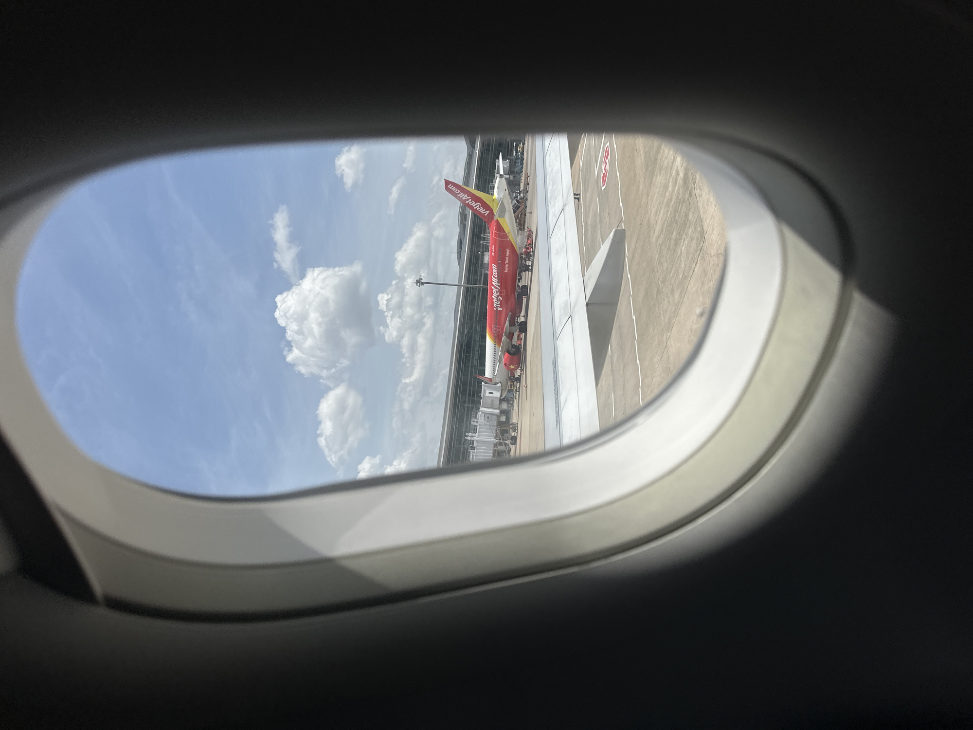 Moving through a Vietnamese airport on a Vietjet departure