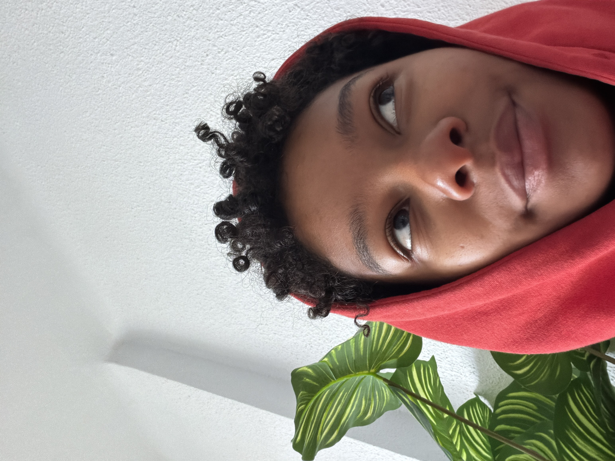 Person in red hoodie, handwritten self-care notes documented in Rubí