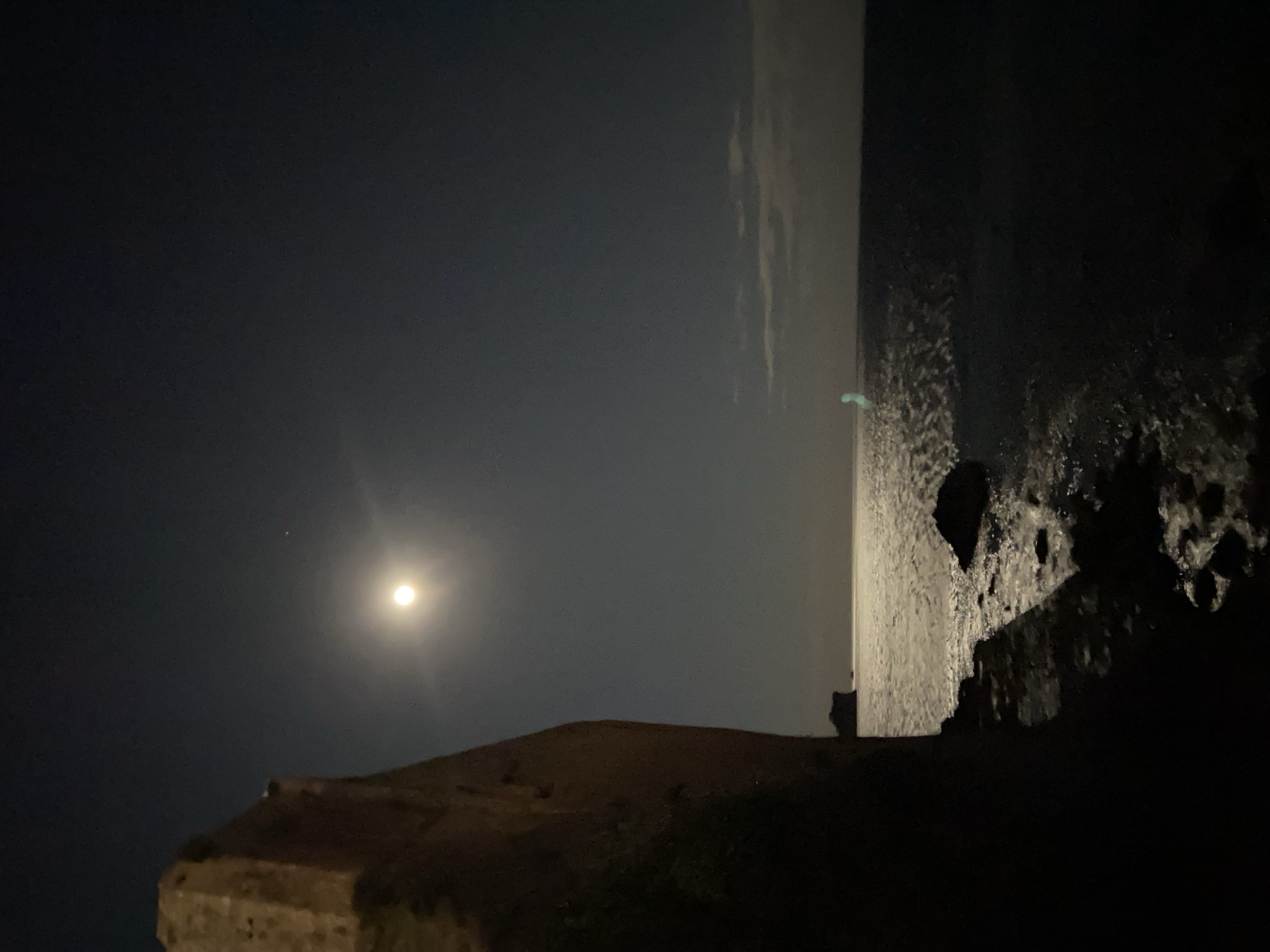 Nearly full moon illuminates Budva coastline at night