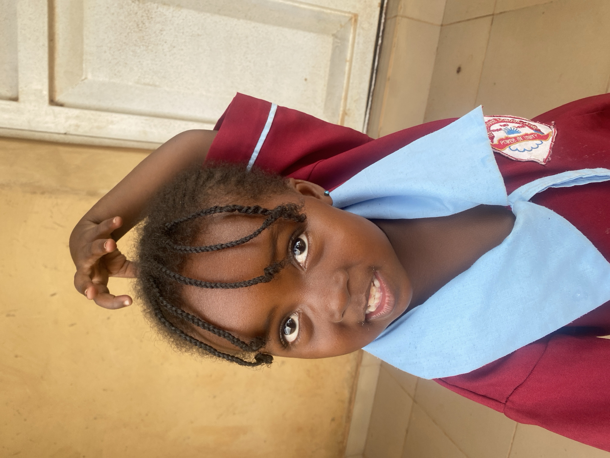 Smiling schoolgirl photographed in Kuru Dungus, Nigeria