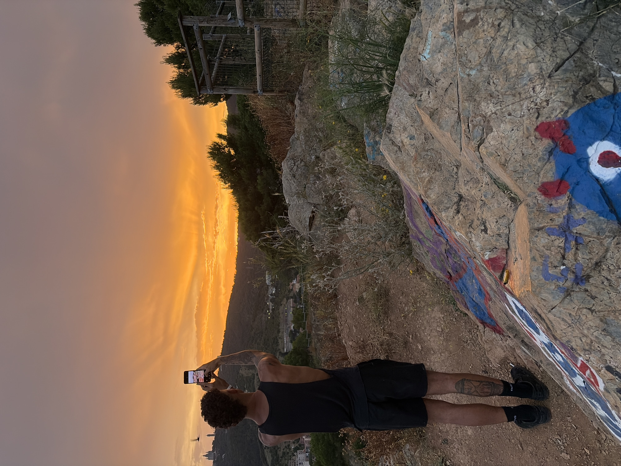 Sunset photography gathering draws people to Barcelona hilltop overlook