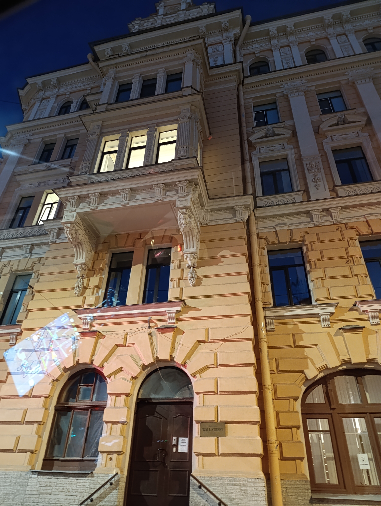 Saint Petersburg streets after dark, neoclassical architecture lit up