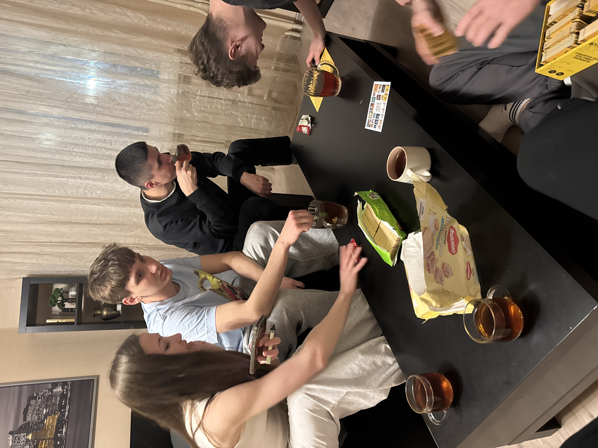 Young adults gather for games and tea in Kazan apartment