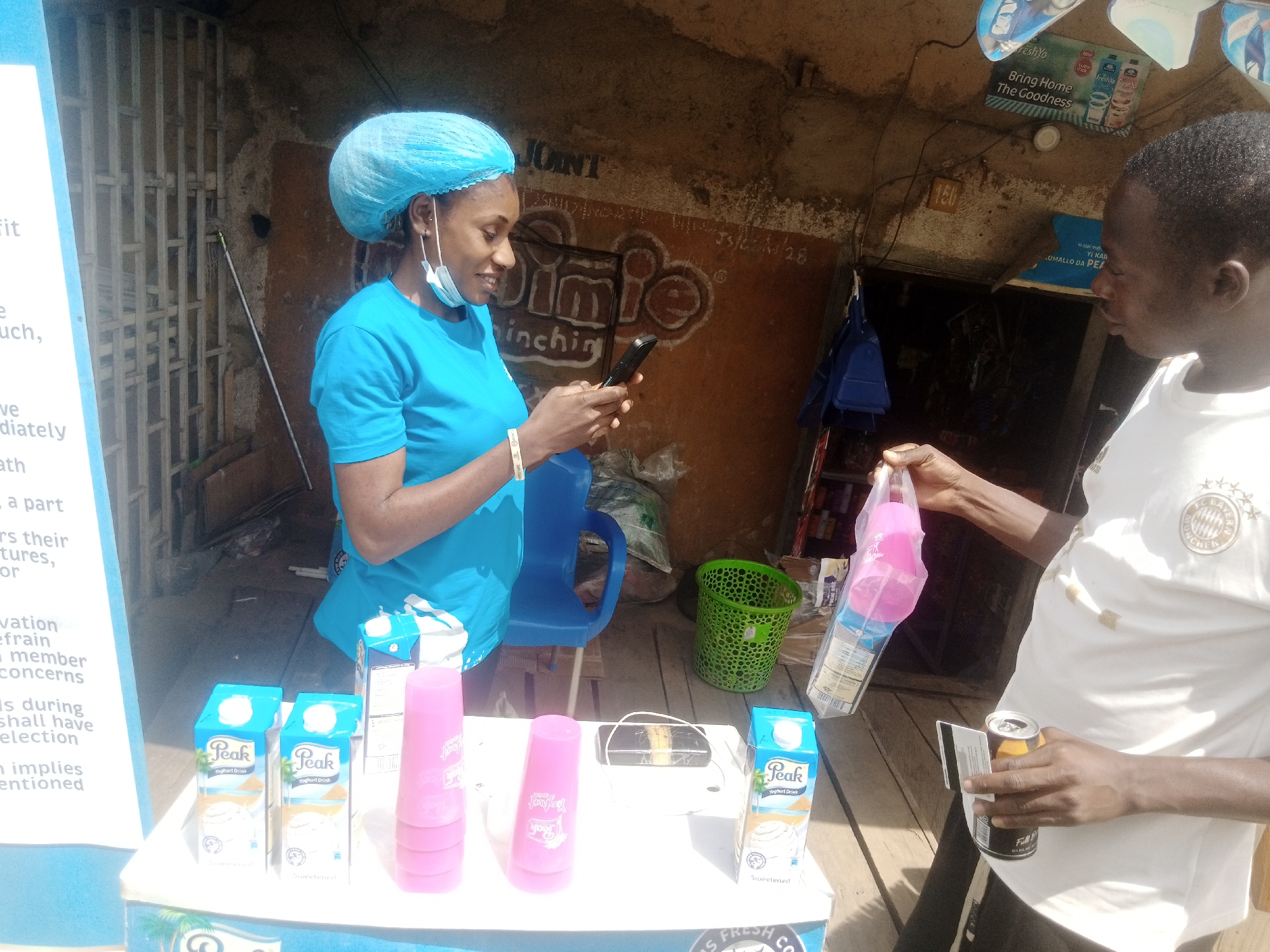 Midday street commerce and traffic across Bukuru, Nigeria