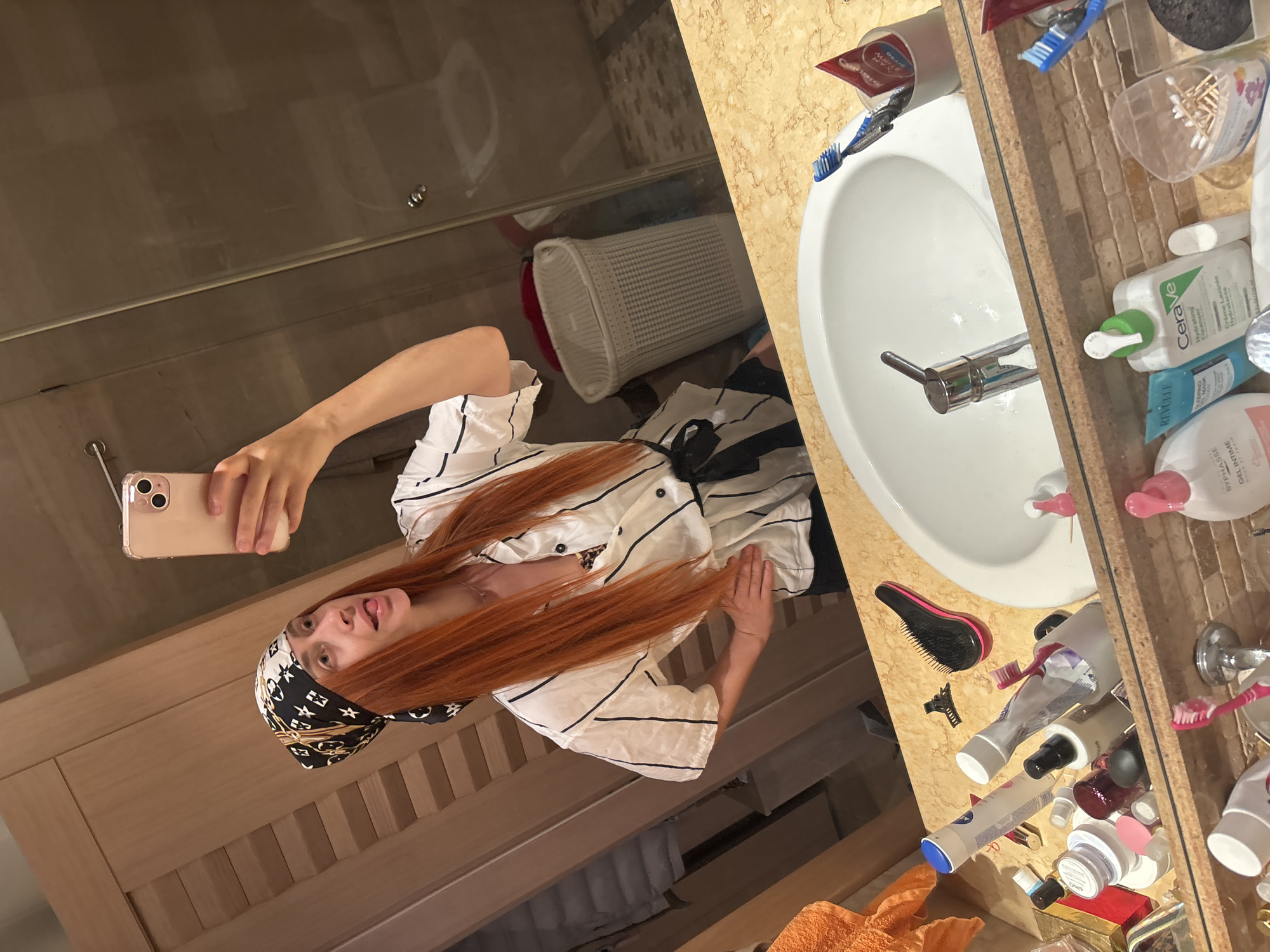Mirror selfie session in a Budva bathroom, June 2026