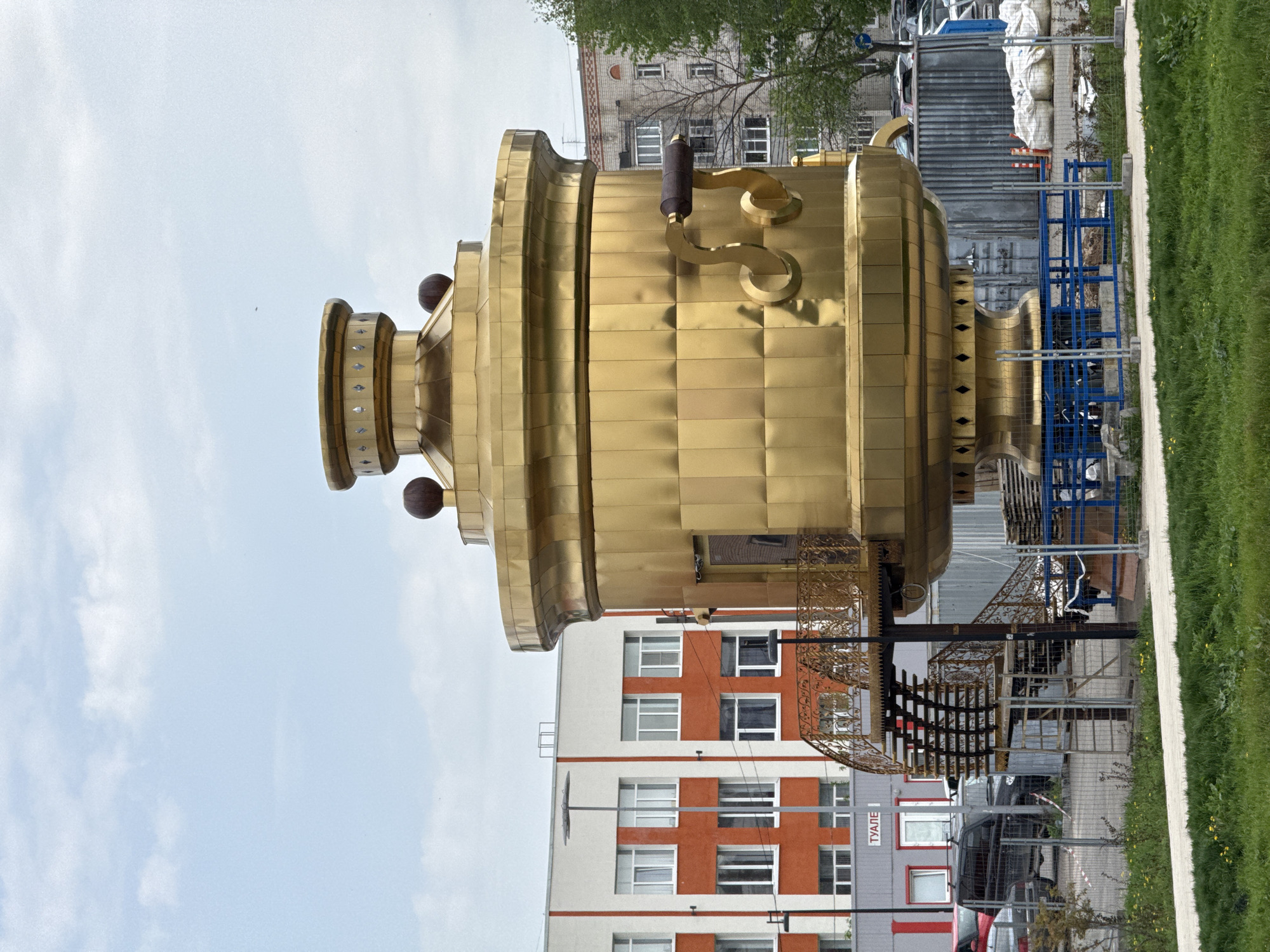 Tourist visits golden samovar monument in Bor, Russia