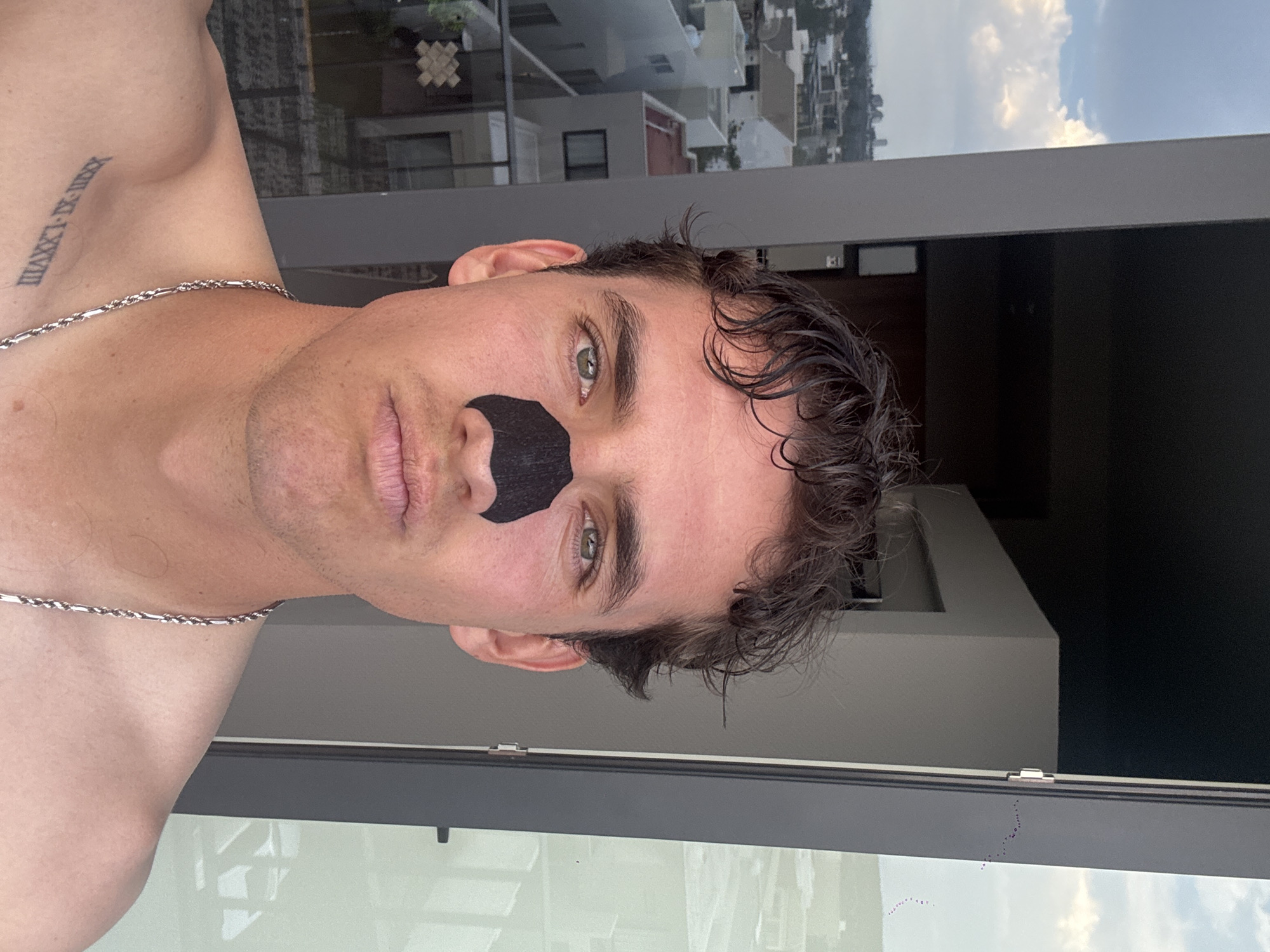 Man with nasal strip observed indoors in León, Mexico