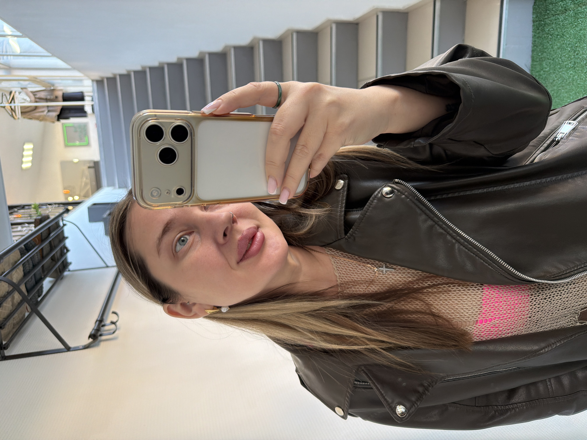 Woman takes mirror selfies indoors in Chaikovsky, Russia