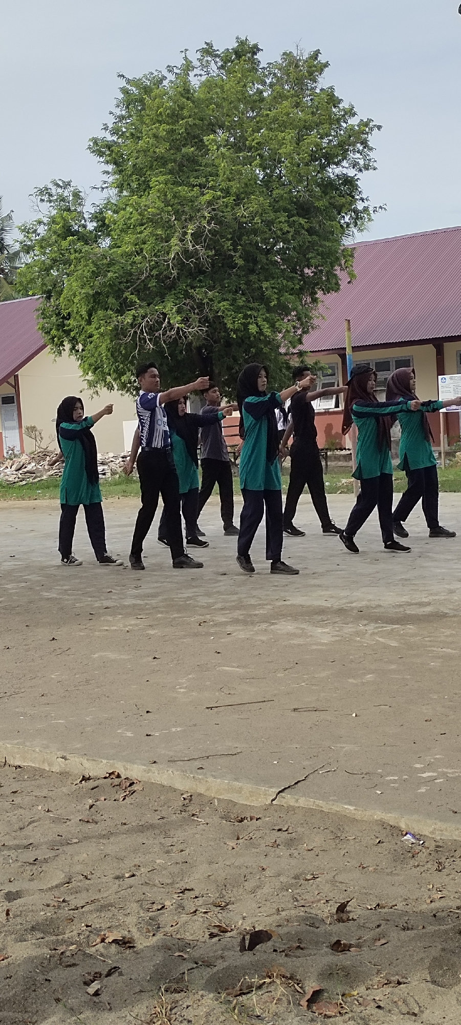Marching drill practice outside a school in Langnibong, Indonesia.