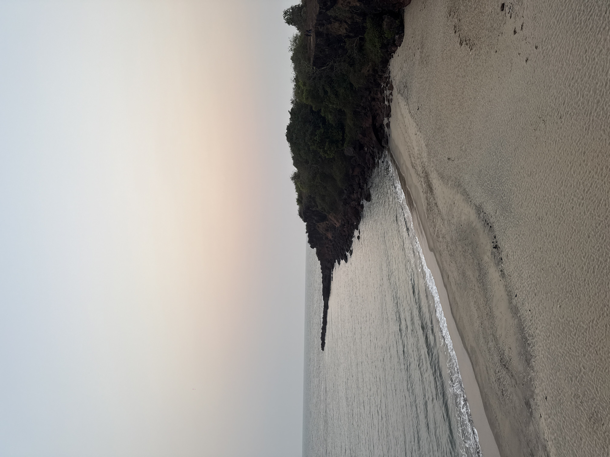Tourist captures coastal views at Querim beach, Goa