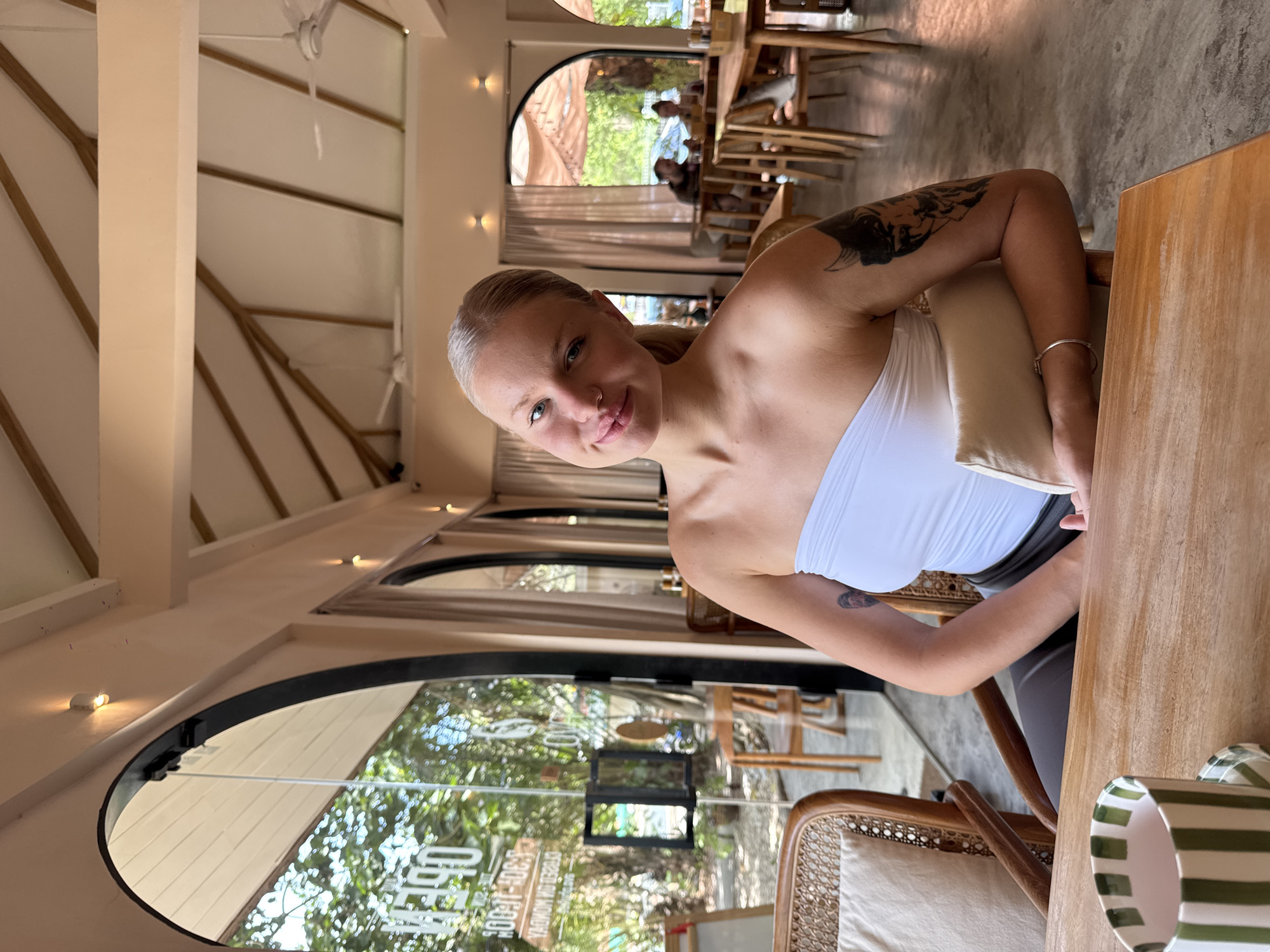 Woman observed at table in Rawai establishment early morning