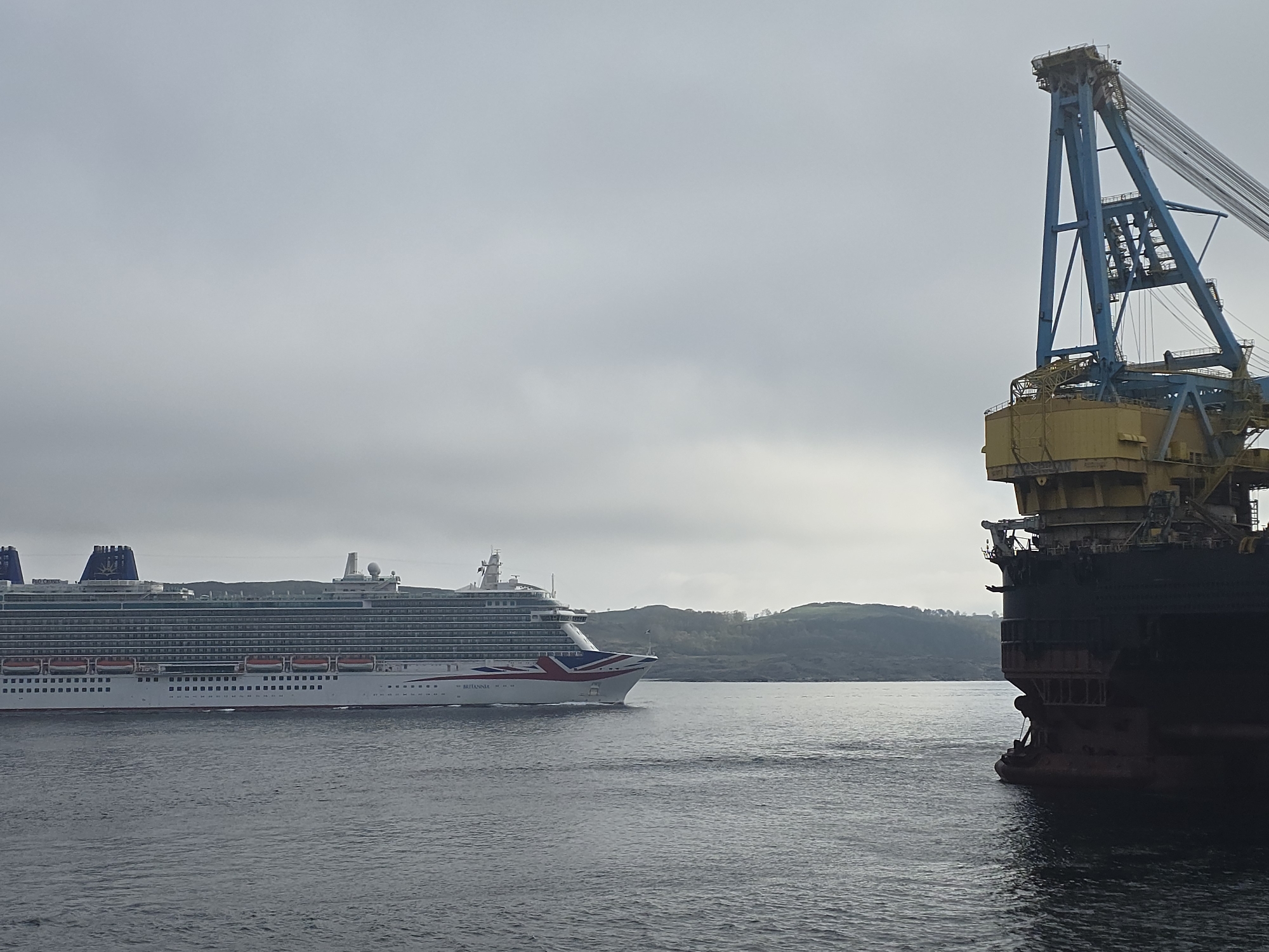 Cruise ship BRITANNIA sails past Randaberg Norway in misty dawn