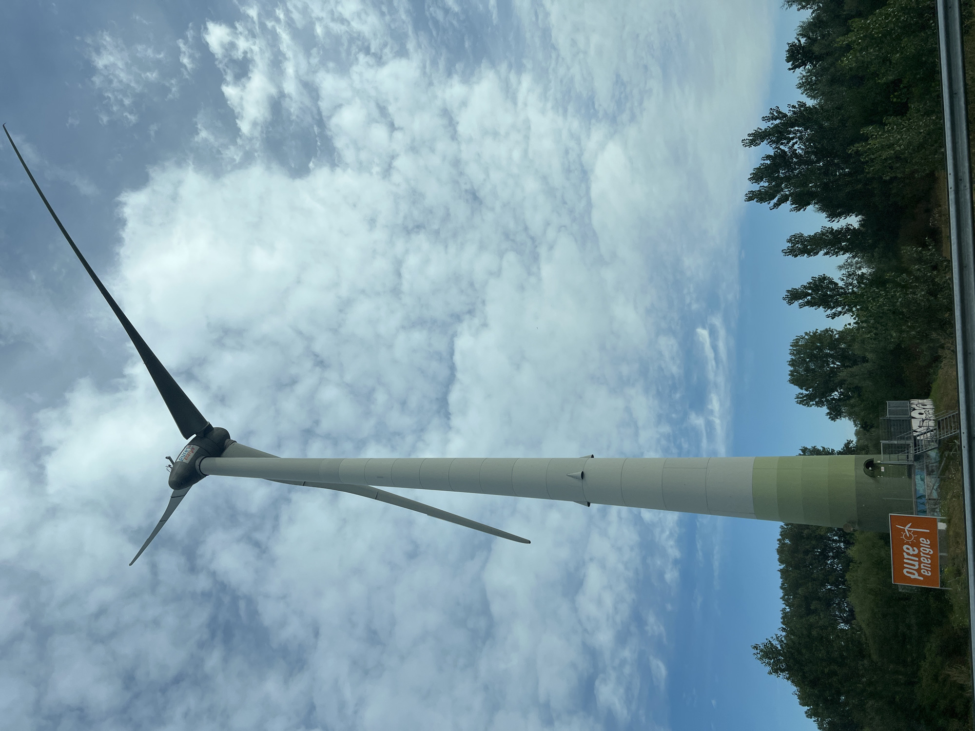 Highway drive through wind turbine country on a cloudy day