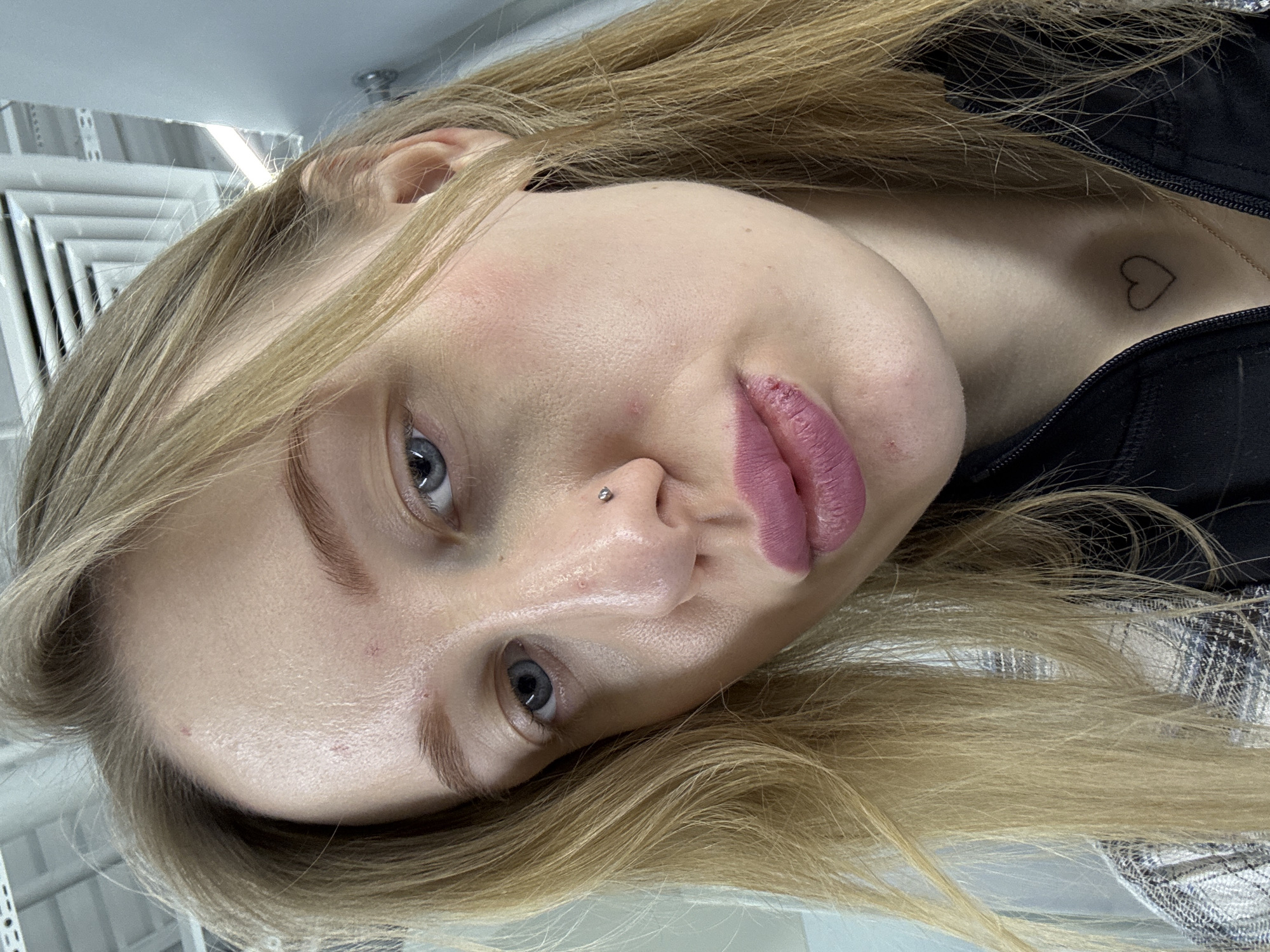 Woman takes multiple selfies while shopping in Russian store