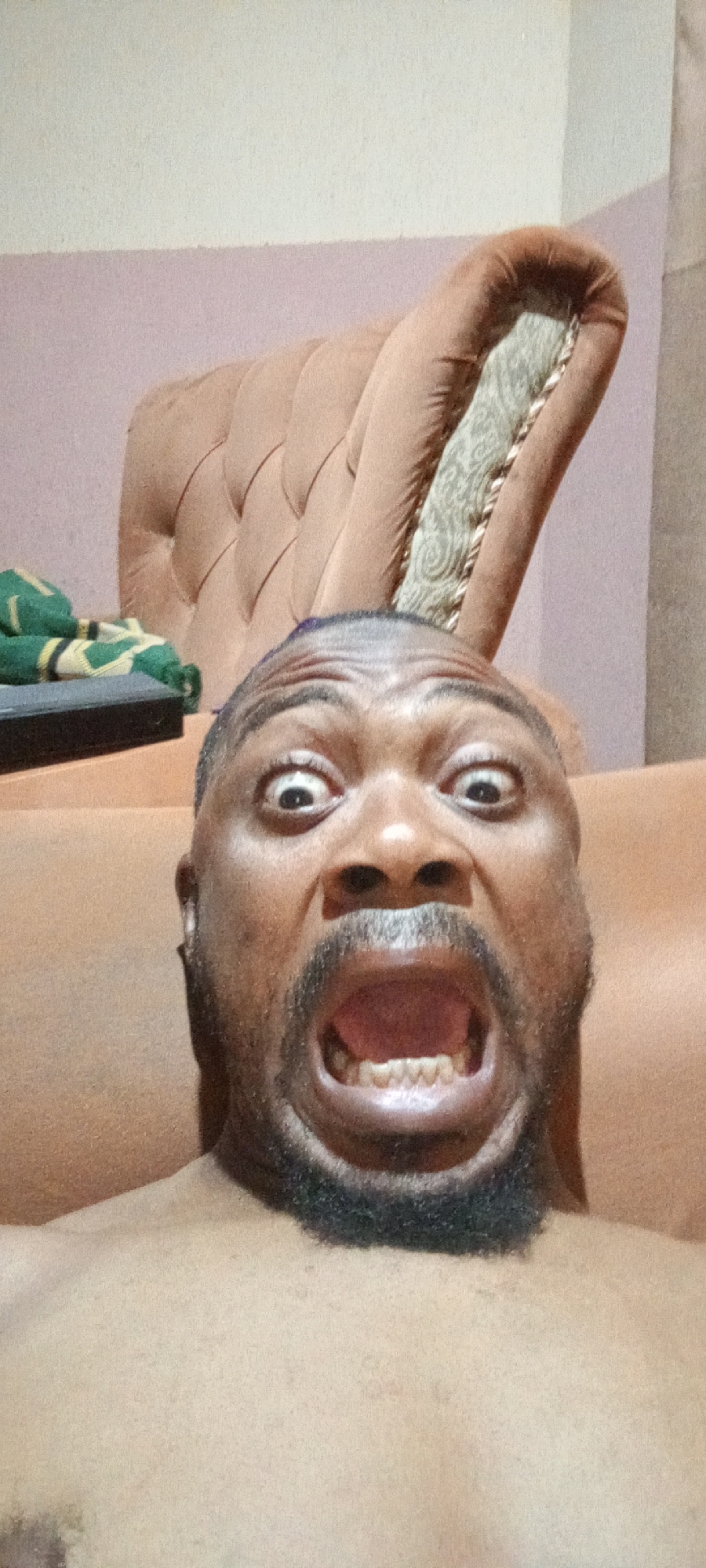 Man makes dramatic facial expression for camera in Nigeria