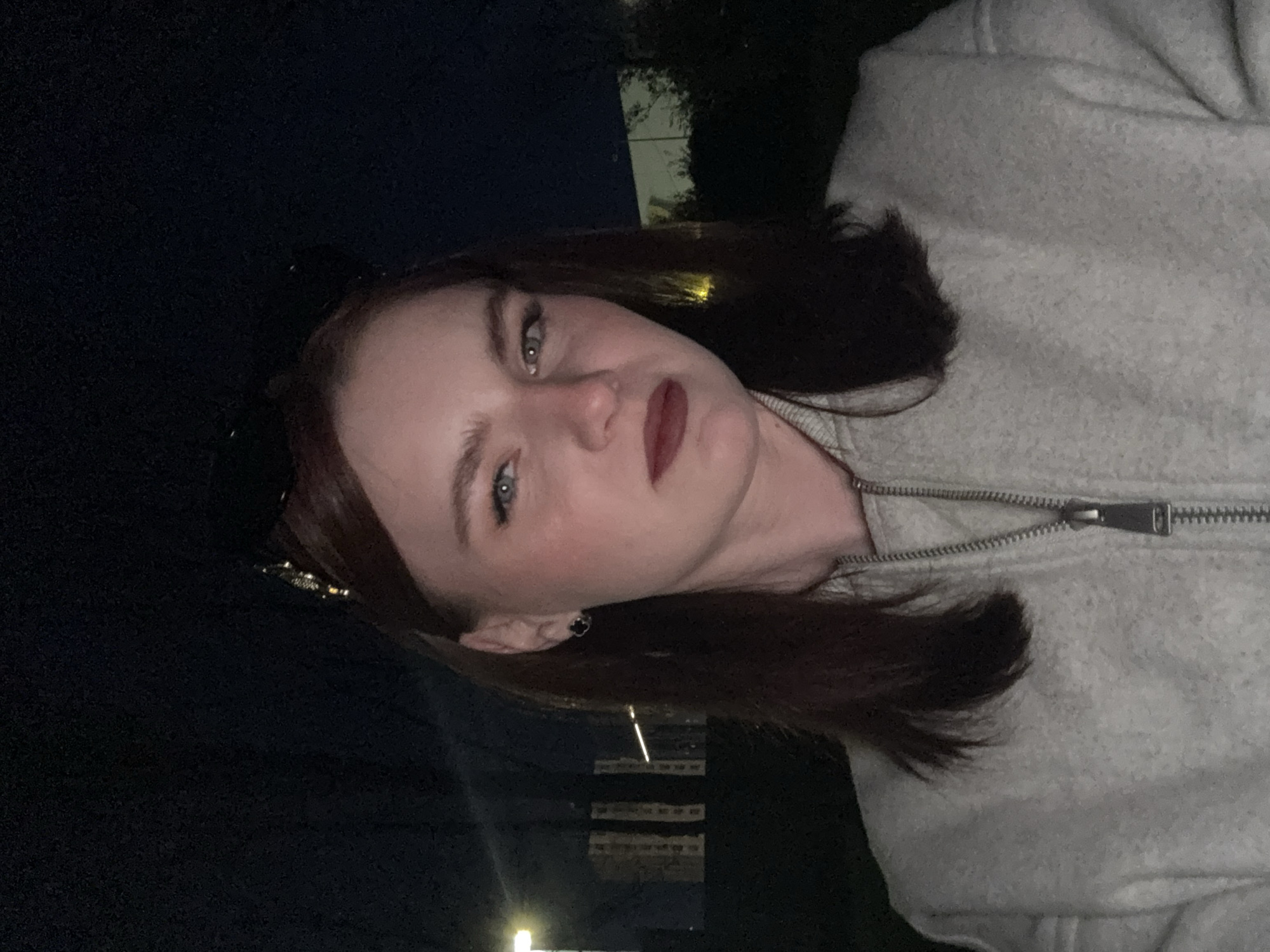 Two women photographed together in Russian urban area at night