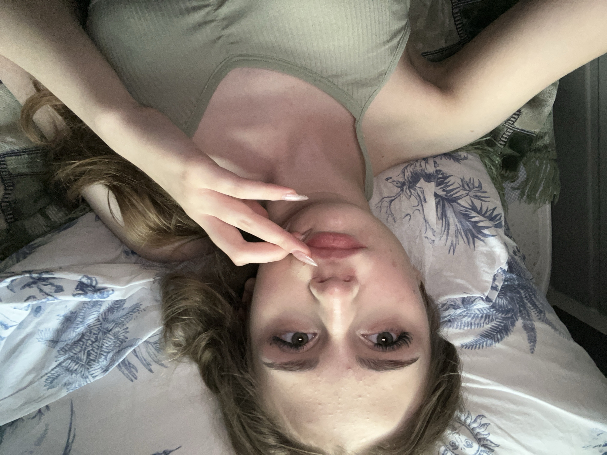 Lazy afternoon selfie session on patterned bedding in Ashkadar
