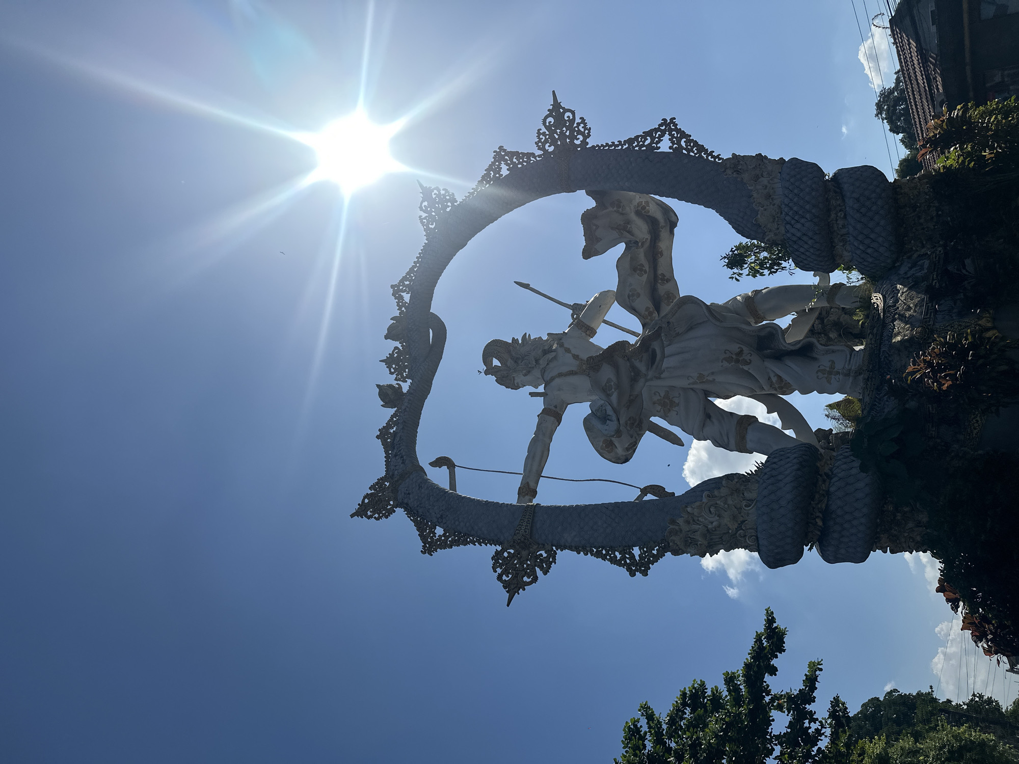 Arjuna statue and street life in Ubud District