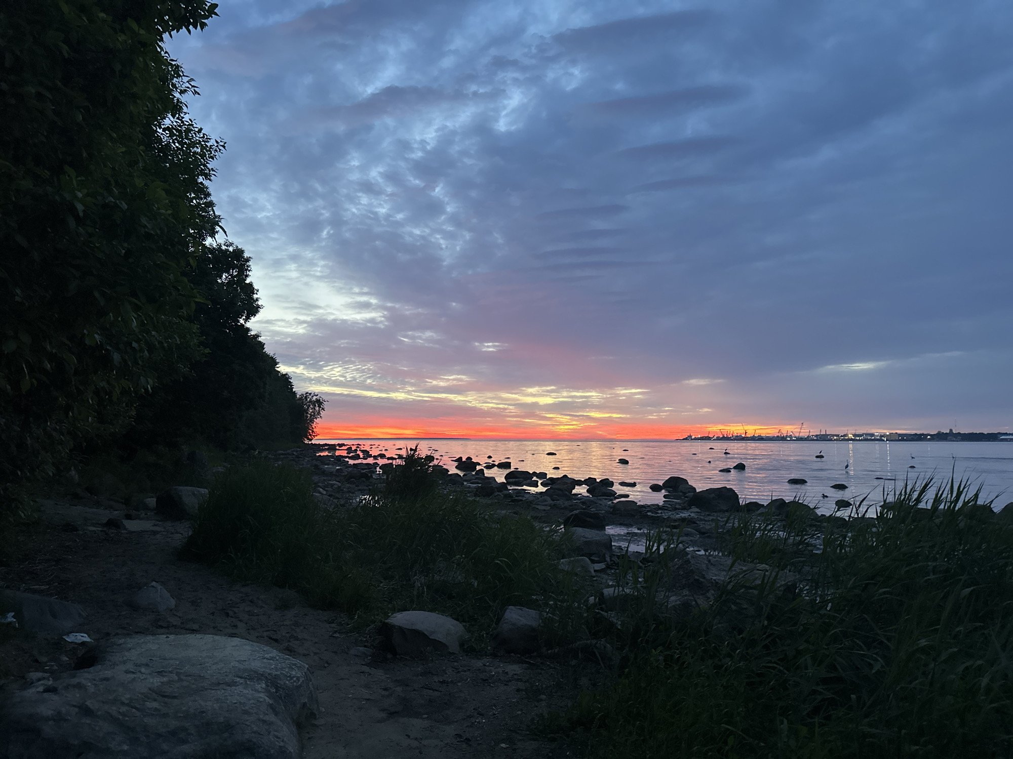 Witness documents Baltic Sea sunset from Tallinn rocky coastline