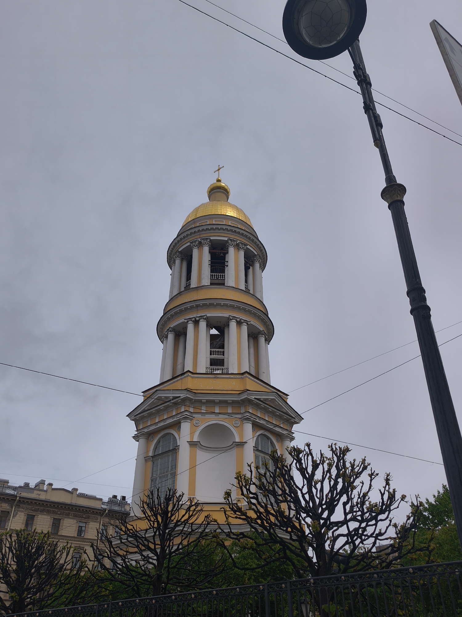 Ornate church with golden domes observed in street scene