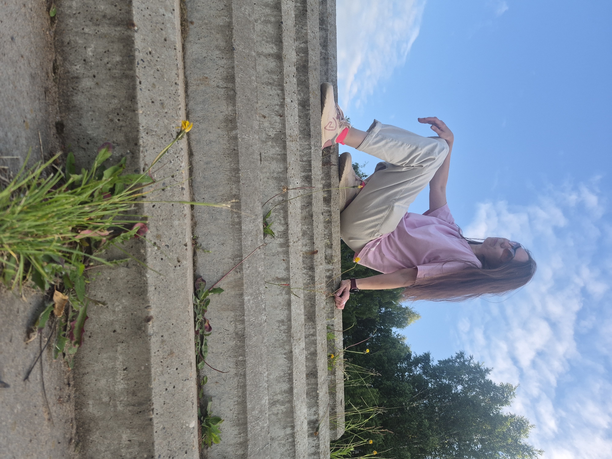 Woman photographed on steps in Chaikovsky, Russia