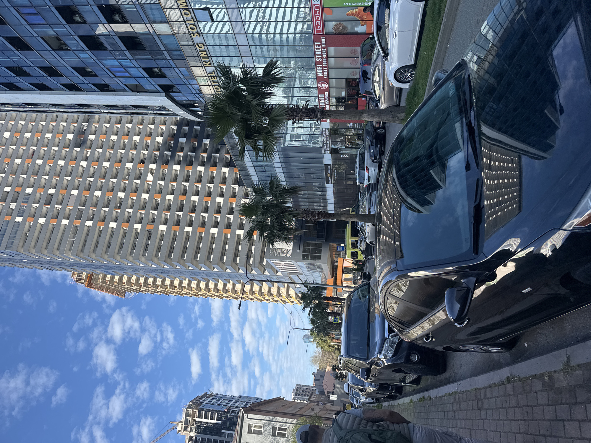 Routine city life documented across urban district April afternoon
