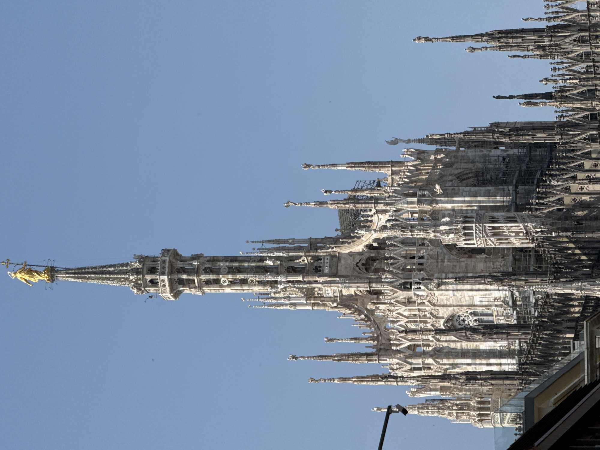Tourist documents morning activities across Milan including Duomo, shopping, dining