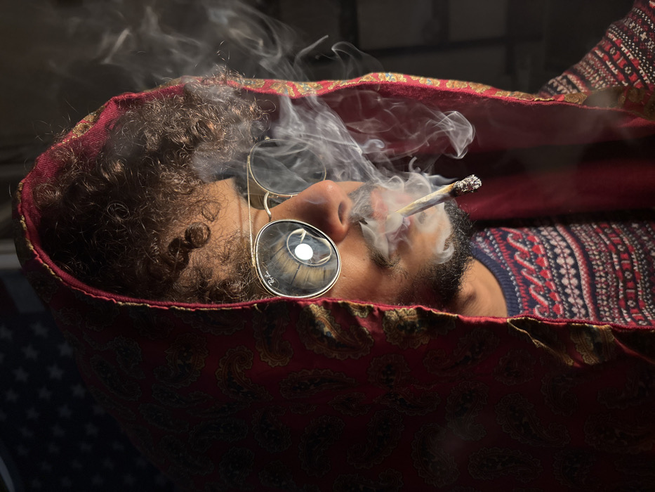 Person documented smoking across Tangier during evening hour