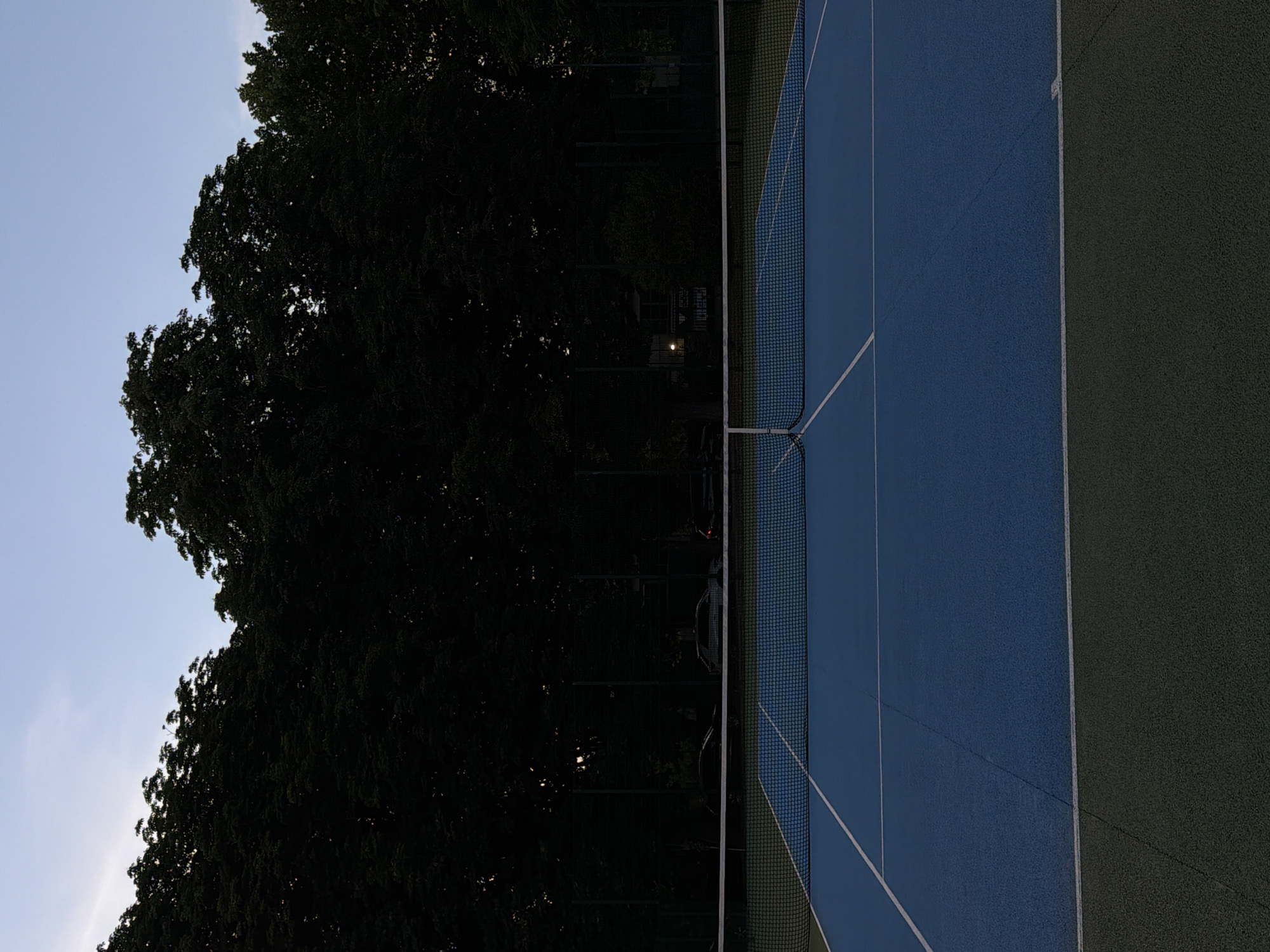 Tennis court in Santiago de Compostela, gear and equipment laid out