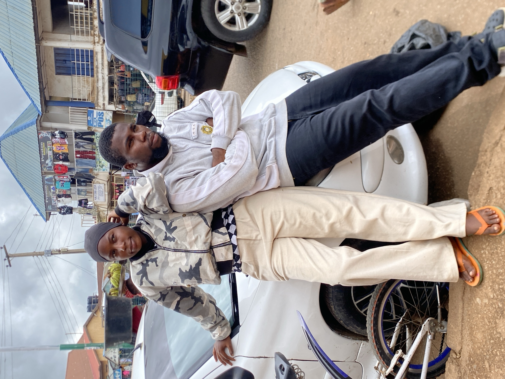 Everyday street life in Bukuru, Nigeria on a rainy afternoon