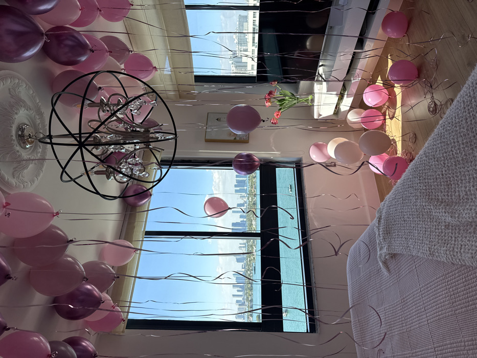 Miami Beach room decorated with pink purple balloons