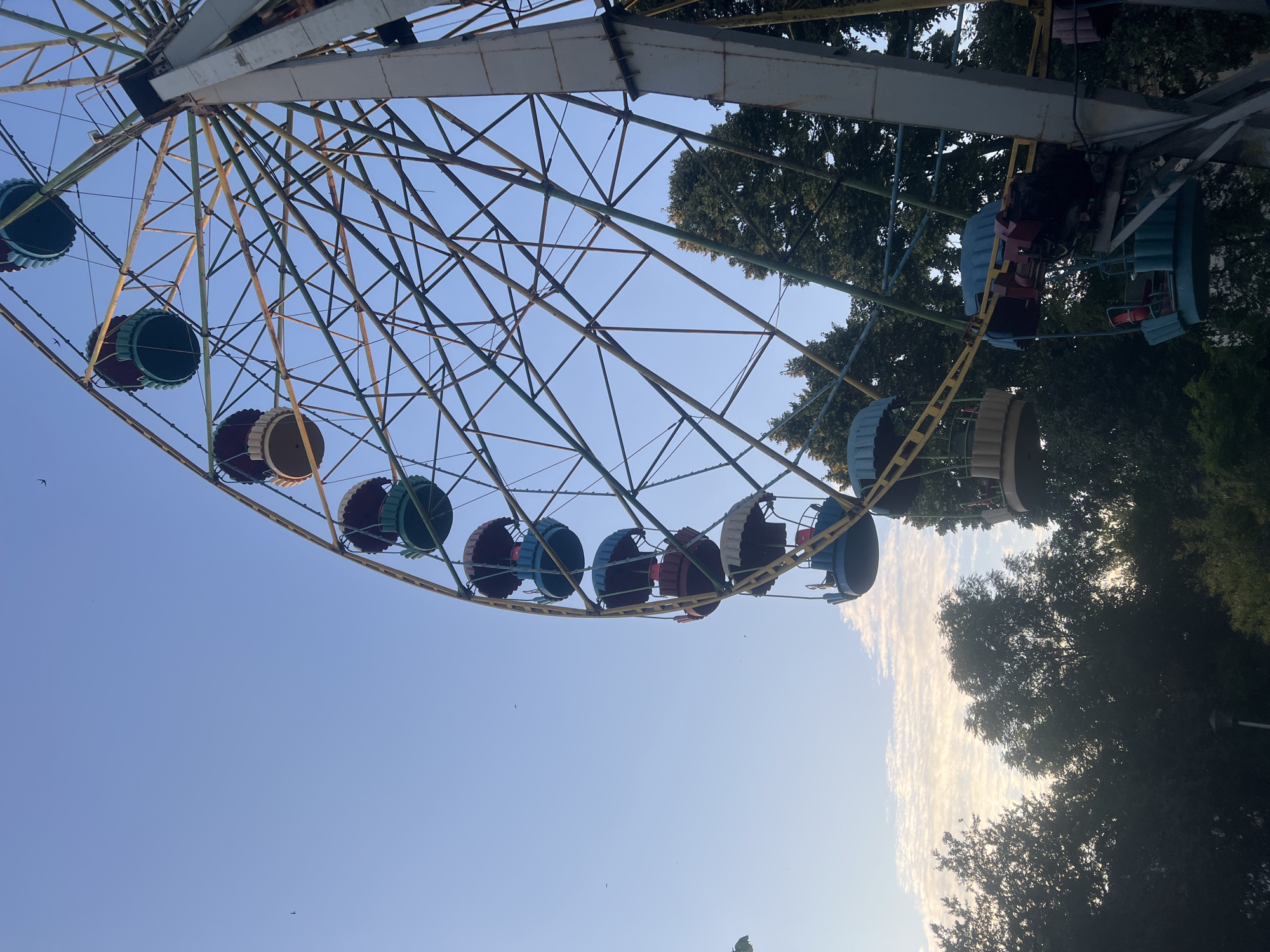 Aging Ferris wheel stands against a clear sky in Zhytomyr
