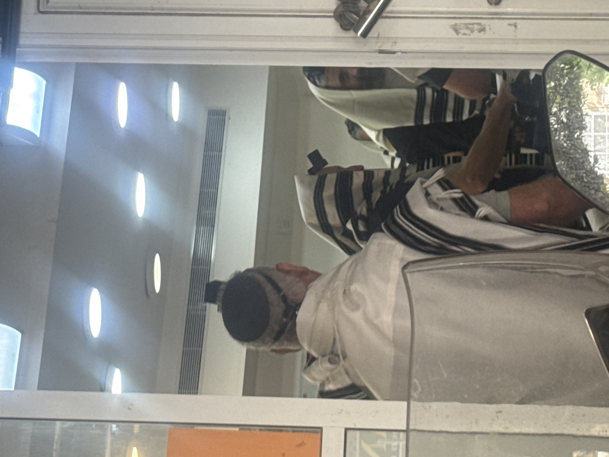 Morning prayers observed in Givatayim with traditional Jewish worship