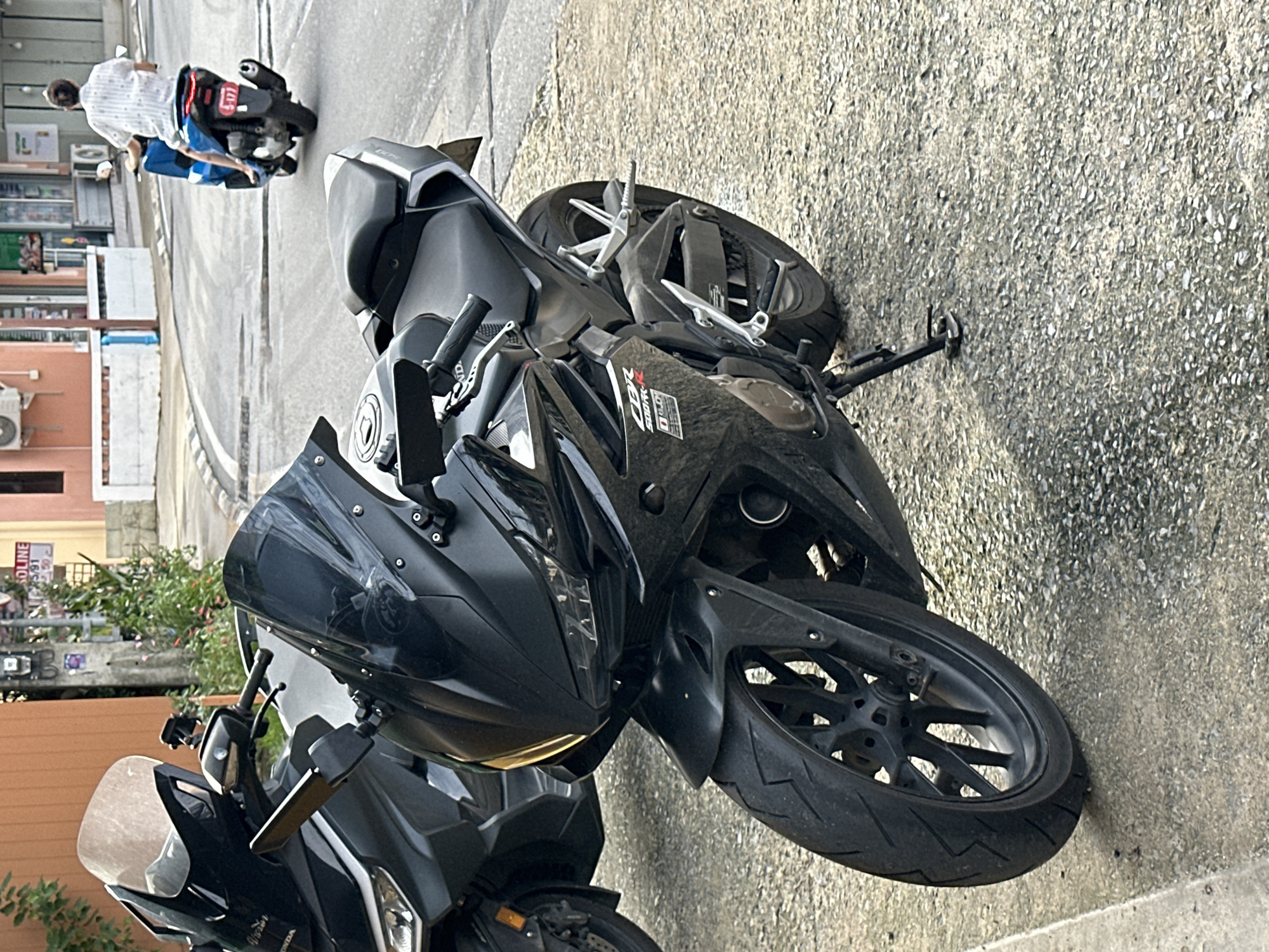 Roadside bike stop on a Karon sidewalk, Phuket