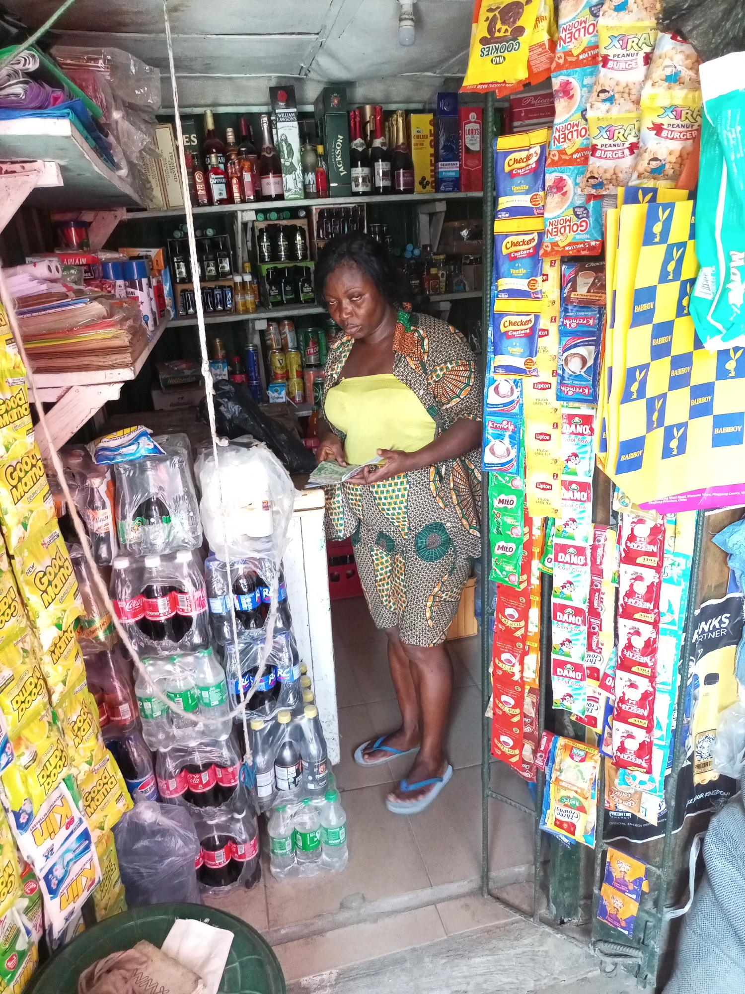 Woman and girl visit neighborhood store in Satellite Town