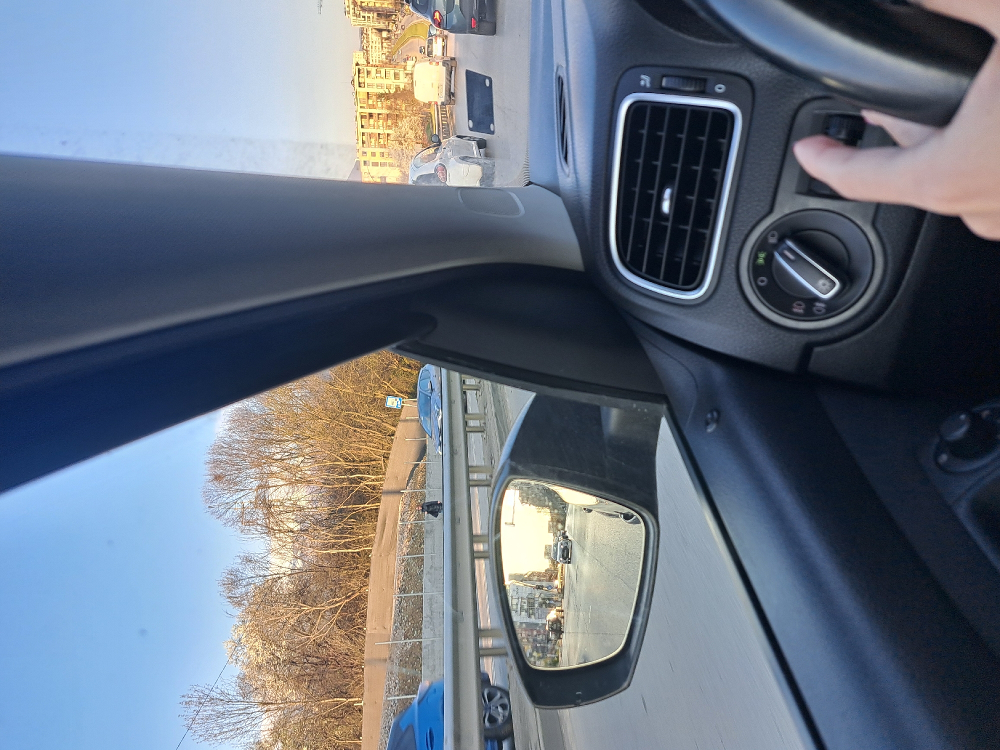 Driver operates dashboard controls in Sofia early morning