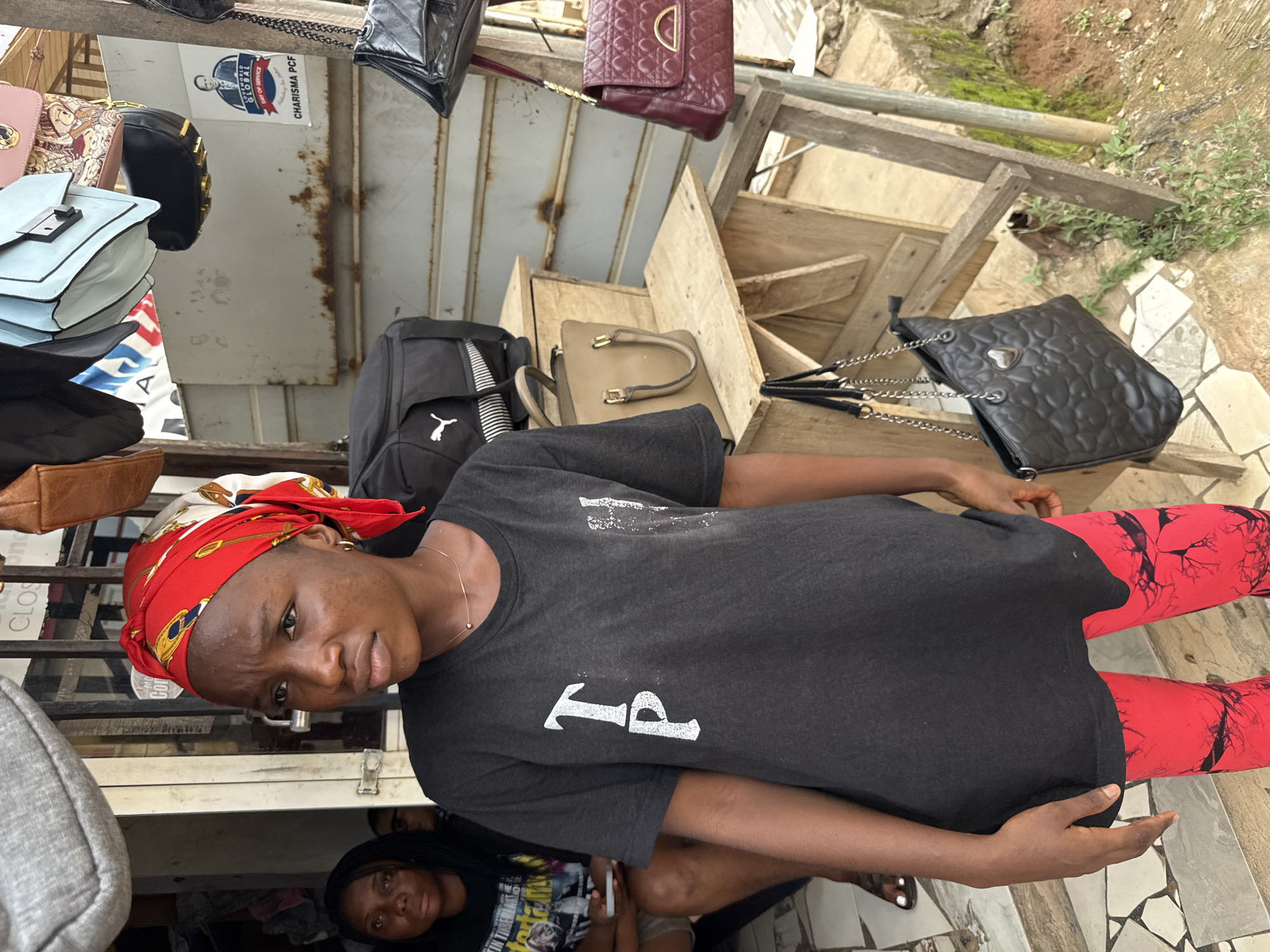 Morning street activity across a busy Abuja neighborhood