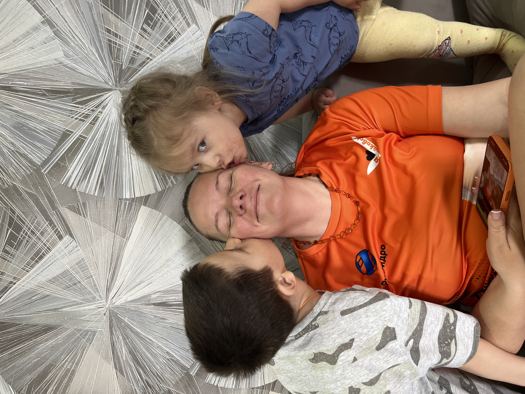 Family moment captured indoors in Chaikovsky, Russia