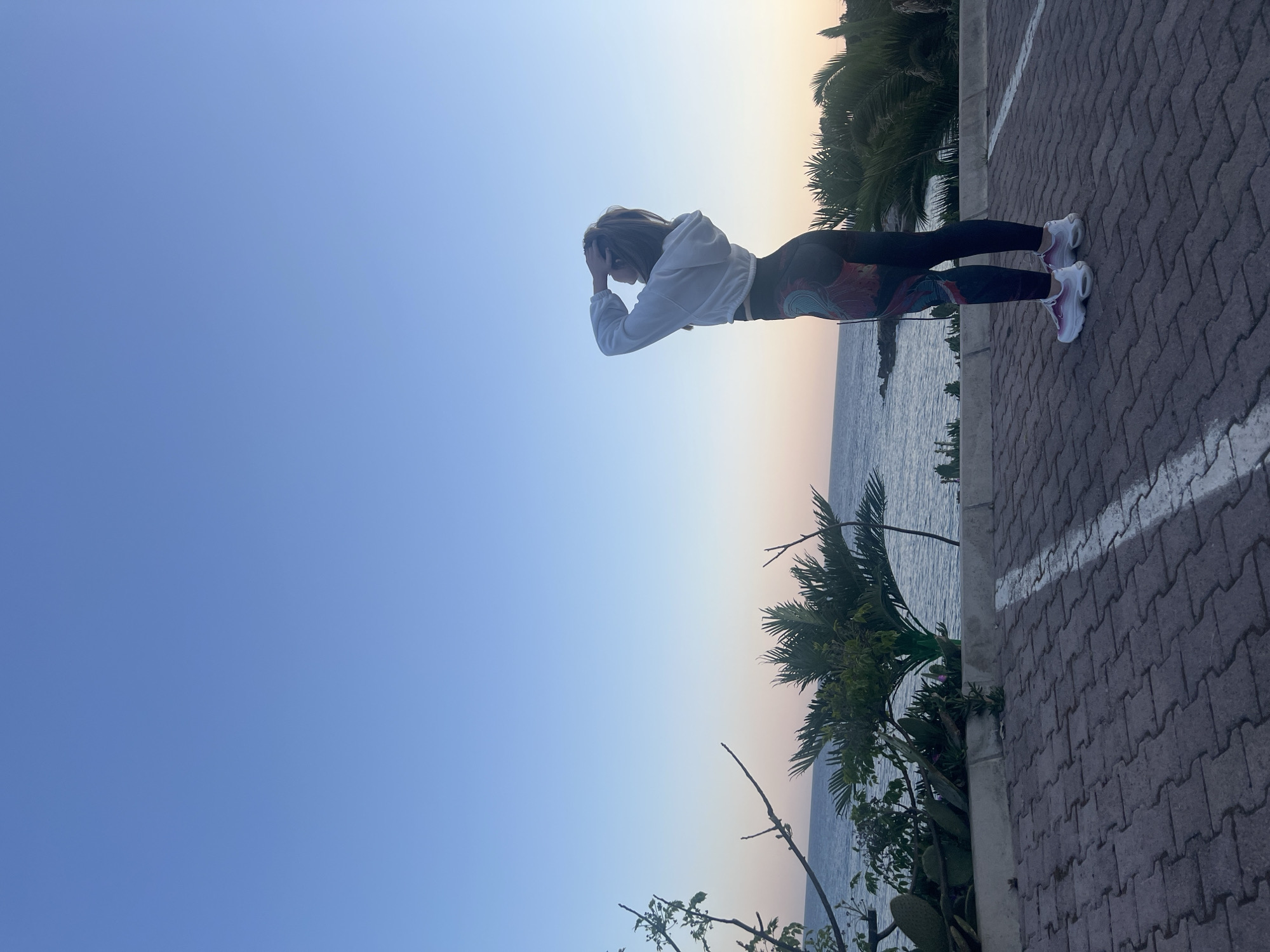 Woman captures coastal sunset memories in Montenegro seaside town