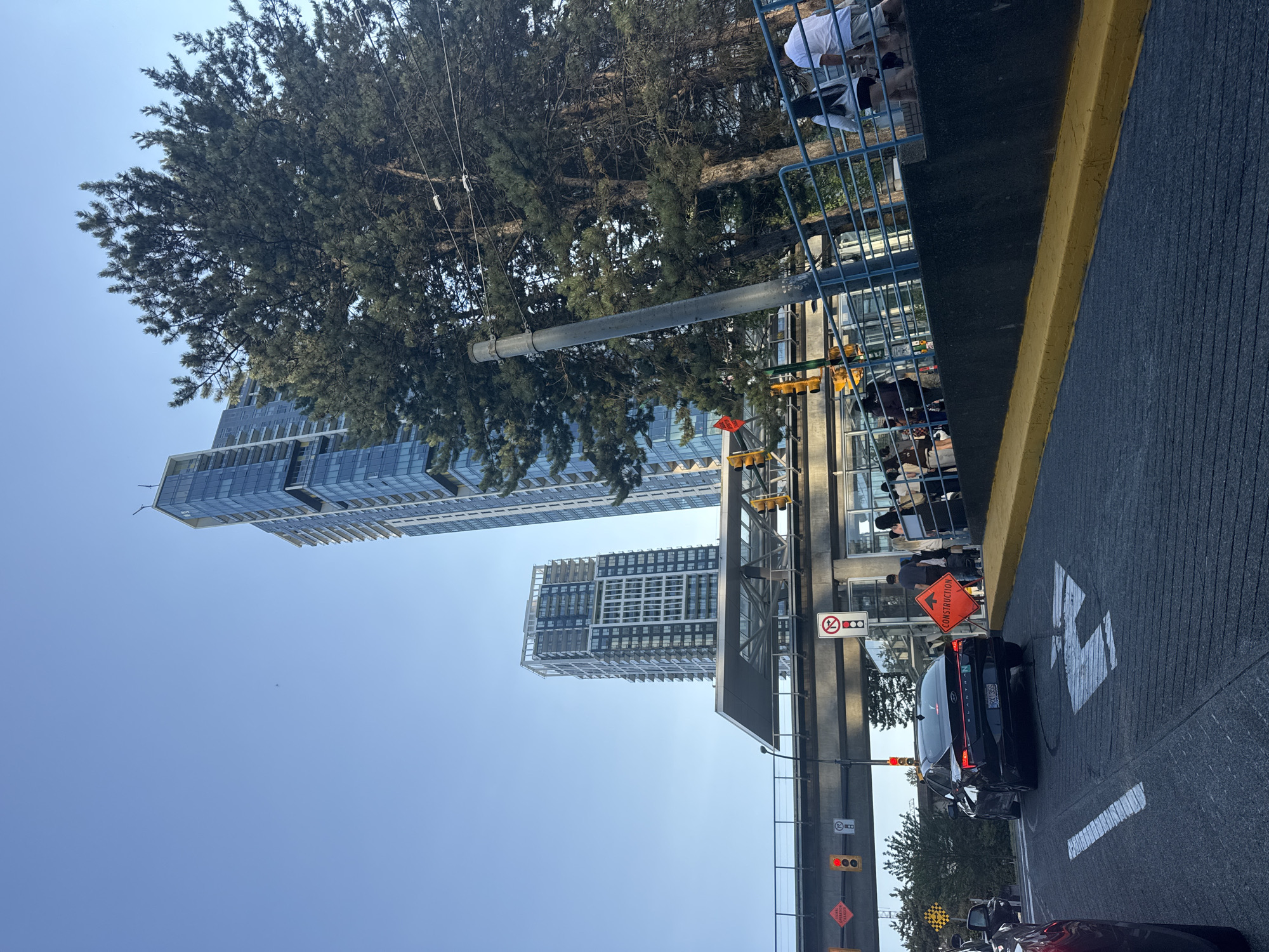Modern transit hub and high-rises along a Burnaby corridor