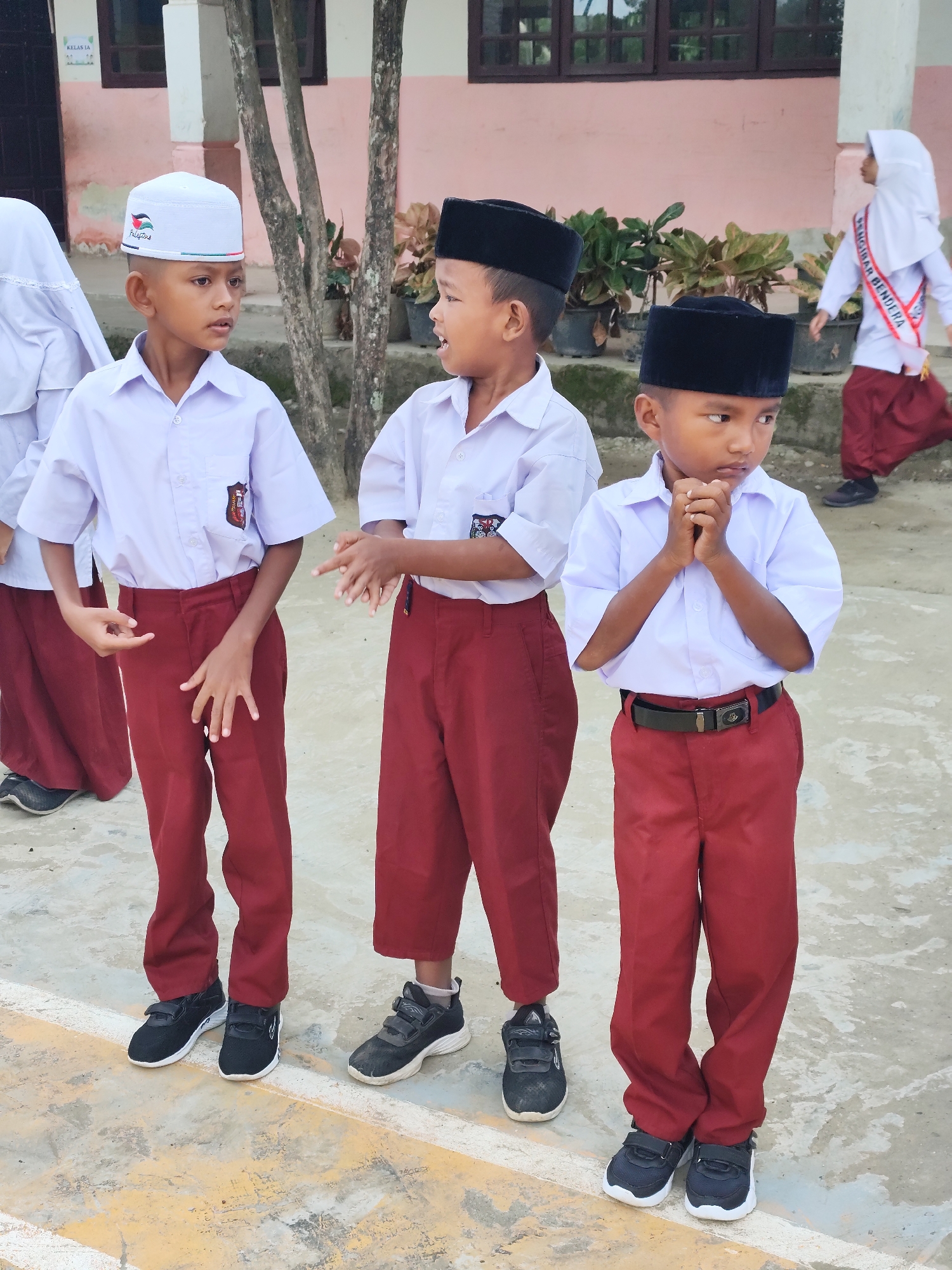 Students in ceremonial sashes at a school commemoration event