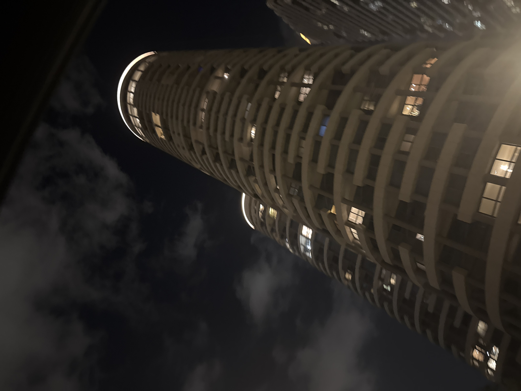 Tel Aviv twin towers at night, smoke and light from below